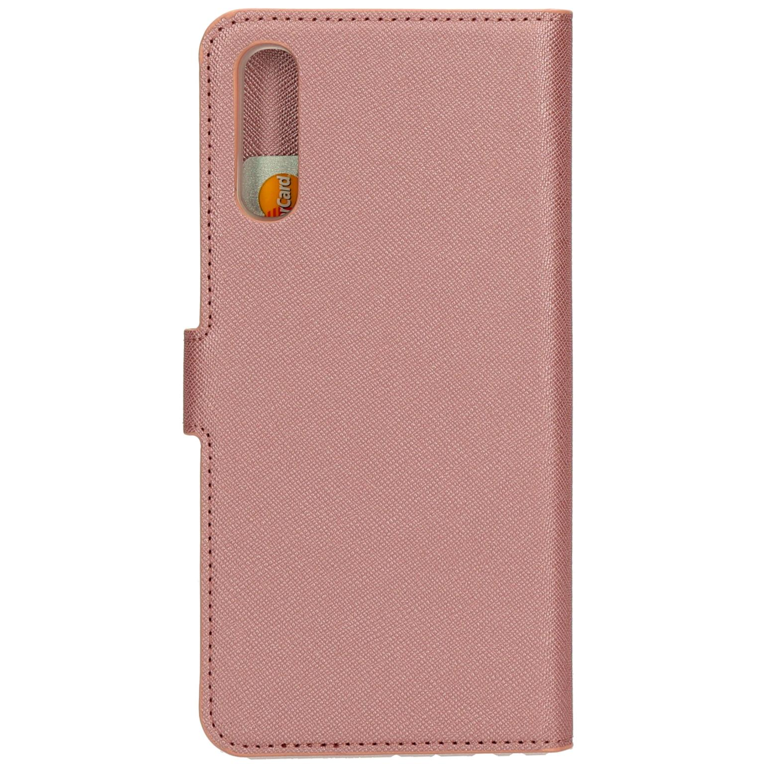 Een roze telefoonhoesje met een kaartsleuf, gesloten met een magnetische sluiting.