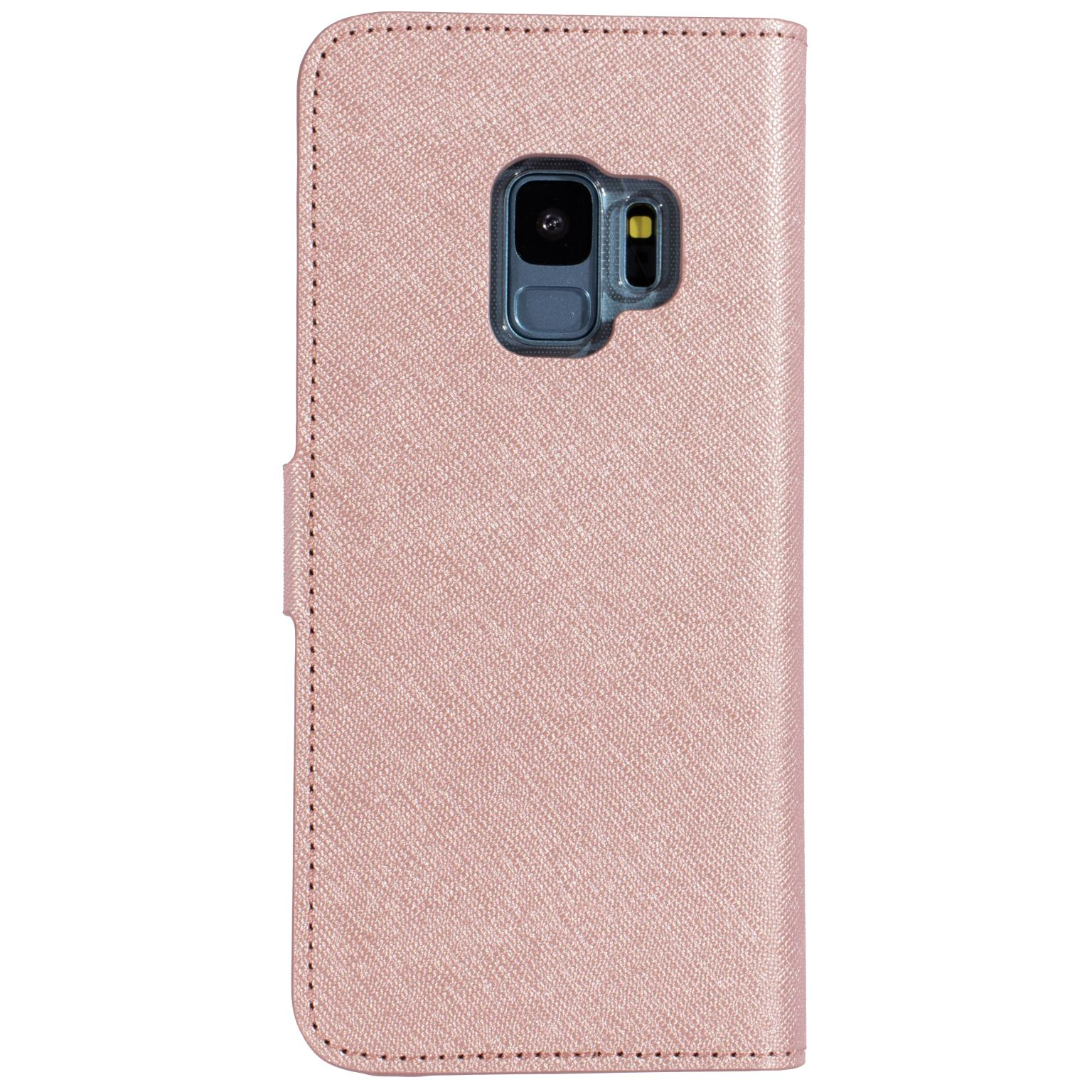 Roze telefoonhoes met cameraholte. Er zit een telefoon in.