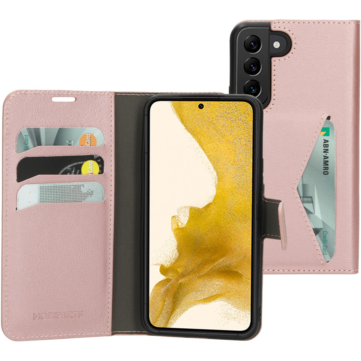 Roze telefoonhoes met Samsung. Er zitten kaarten in de hoes. De hoes is open op wit.