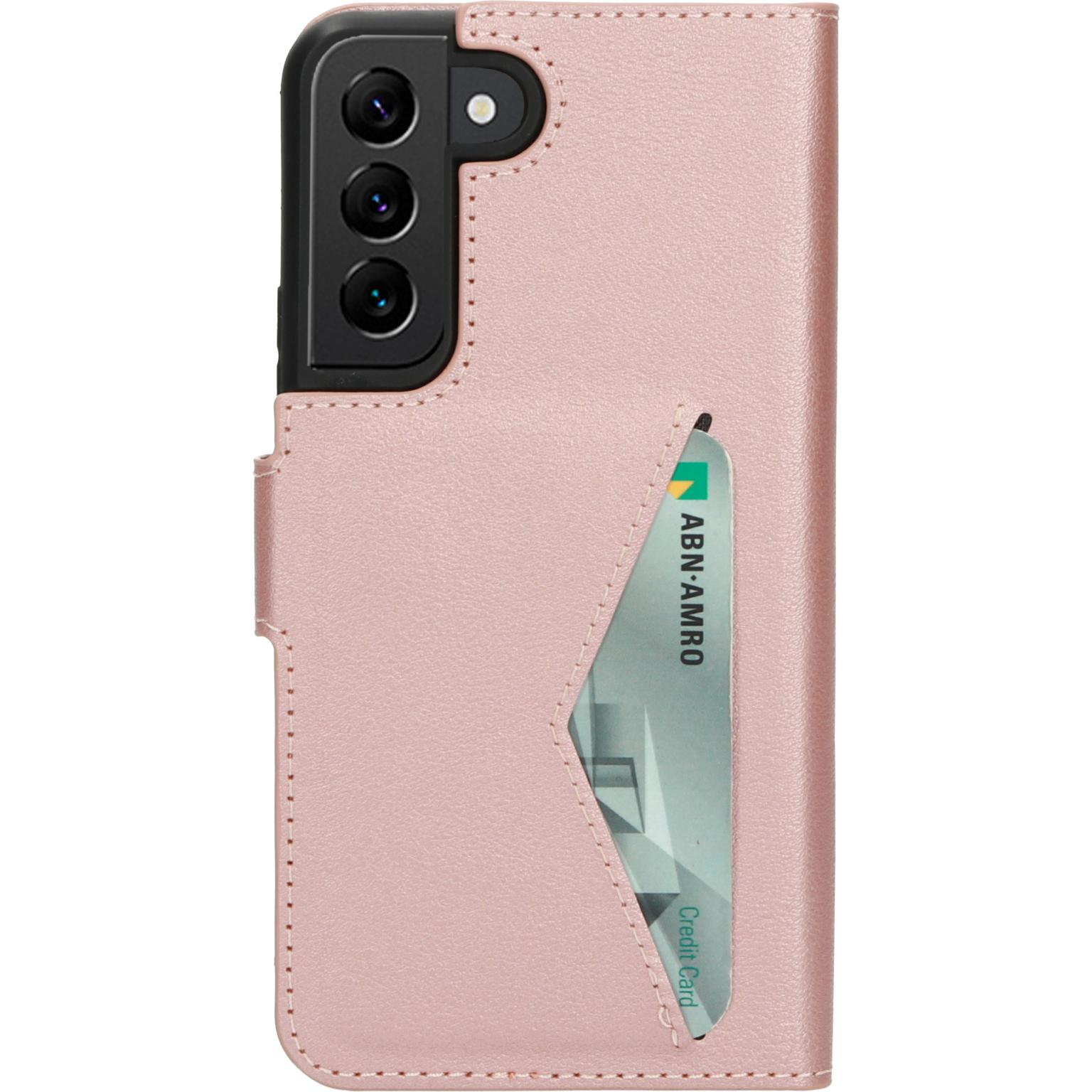 Roze telefoonhoesje met telefoon en kaart. ABN-AMRO creditcard is zichtbaar.