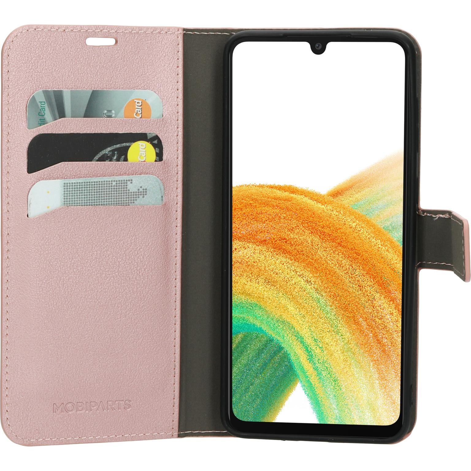 Open roze telefoonhoes met een telefoon en kaarten. Telefoon toont abstract ontwerp.