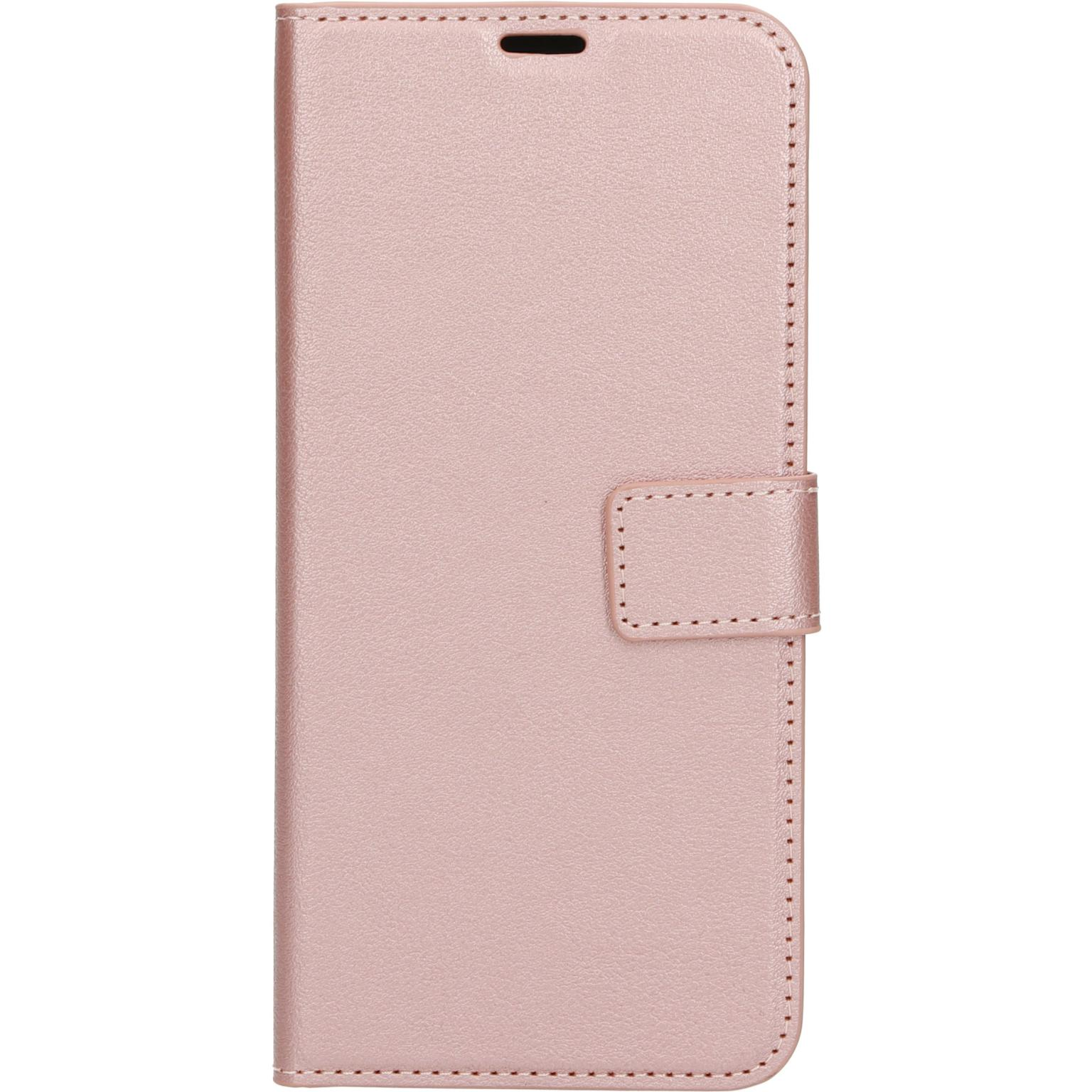 Roze telefoonhoes, gesloten, met magnetische sluiting. Witte achtergrond.