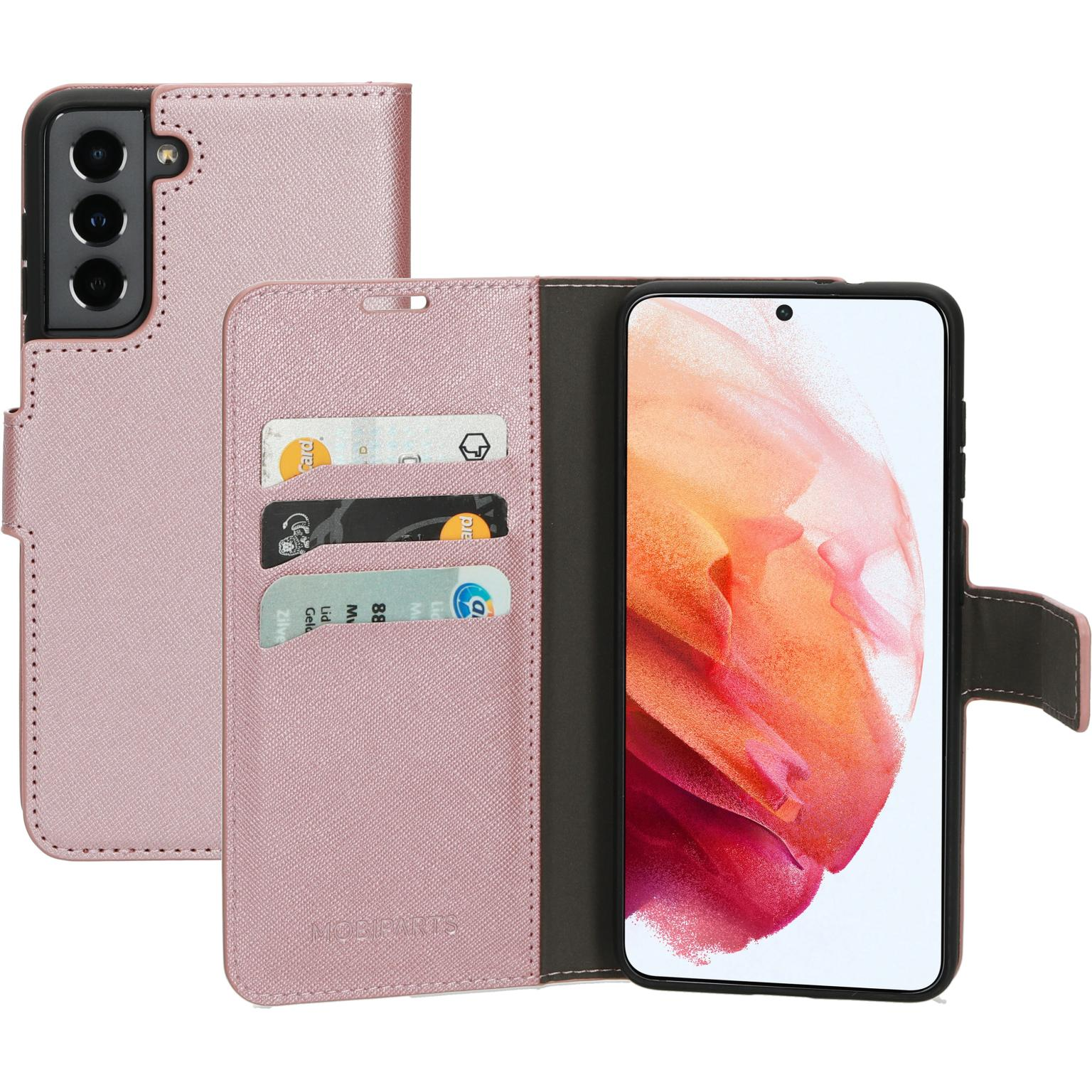 Roze telefoonhoes open, met een telefoon, creditcards en een magnetische sluiting.