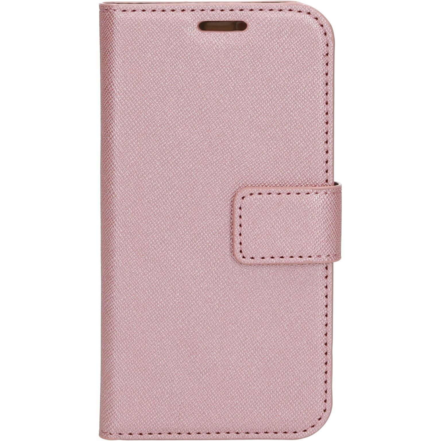 A pink phone case, closed, with a magnetic strap.