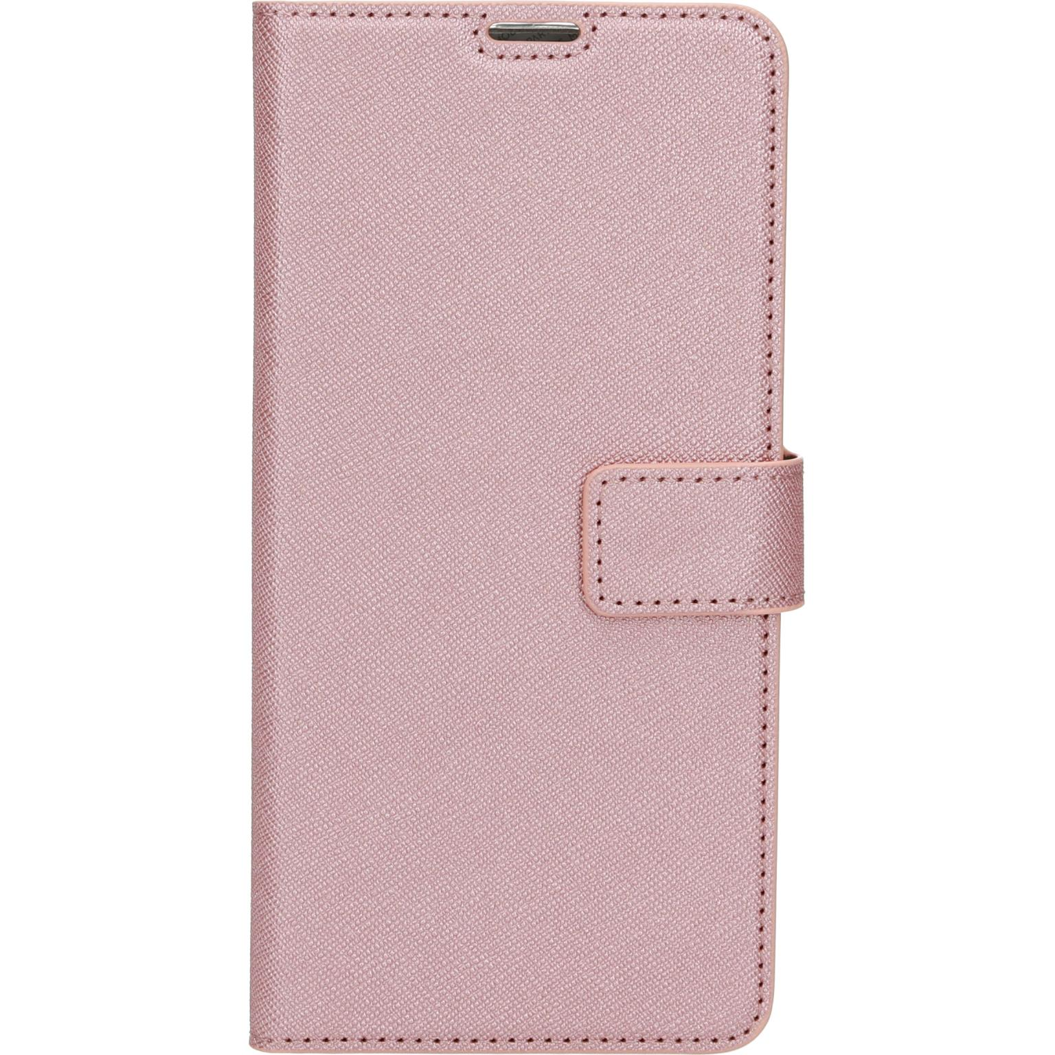Roze telefoonhoesje. Textuur, magnetische sluiting, stiksels. Gesloten, verticaal.