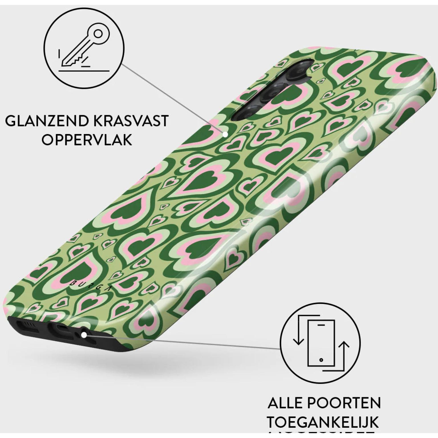 Phone case with green background and pink heart shapes, angled view.