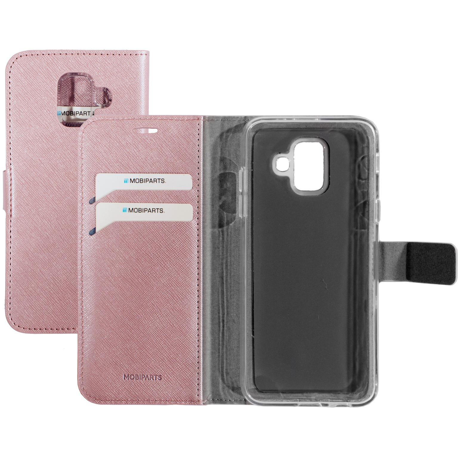 Roze telefoonhoes met telefoon. Hoesje heeft kaartsleuven en magneetsluiting. Zwart scherm.