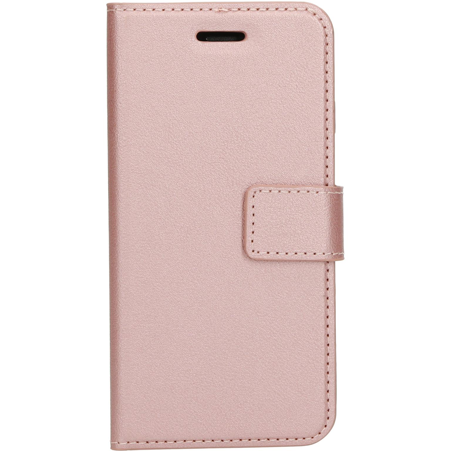 Roze telefoonhoes. Leerachtig materiaal. Sluit met een flap en magnetische sluiting.