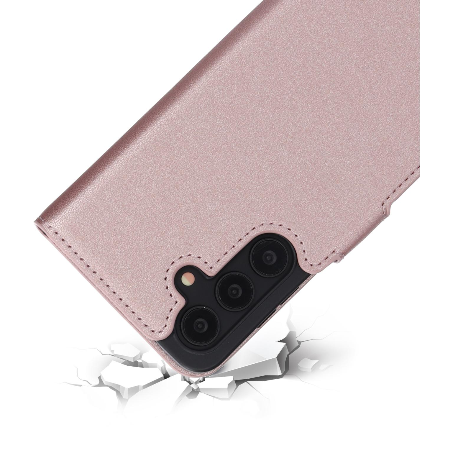 Roze telefoonhoes met drievoudige camera. Open op gebroken beton.