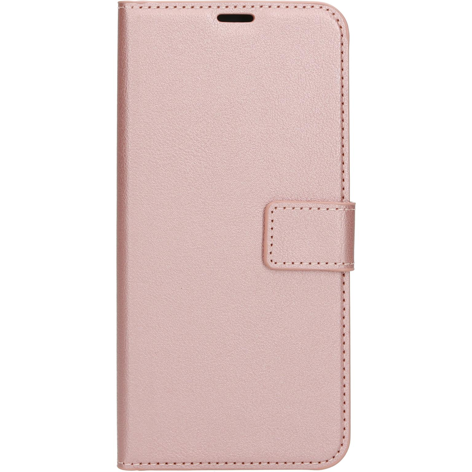 Een roze telefoonhoes met een magnetische sluiting. Het is een portemonnee-hoes.
