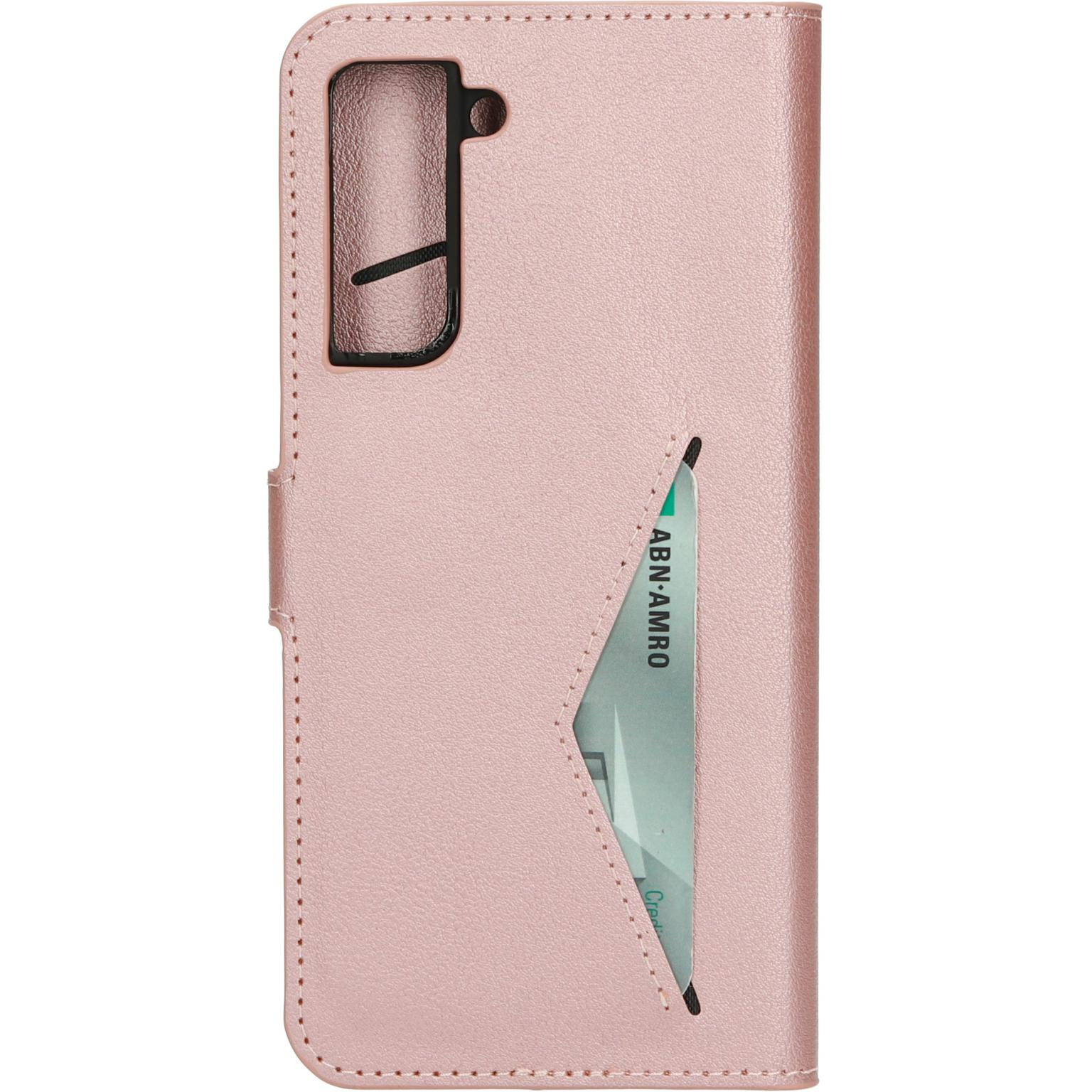 Pink phone case with a credit card slot. The phone has a camera bump.