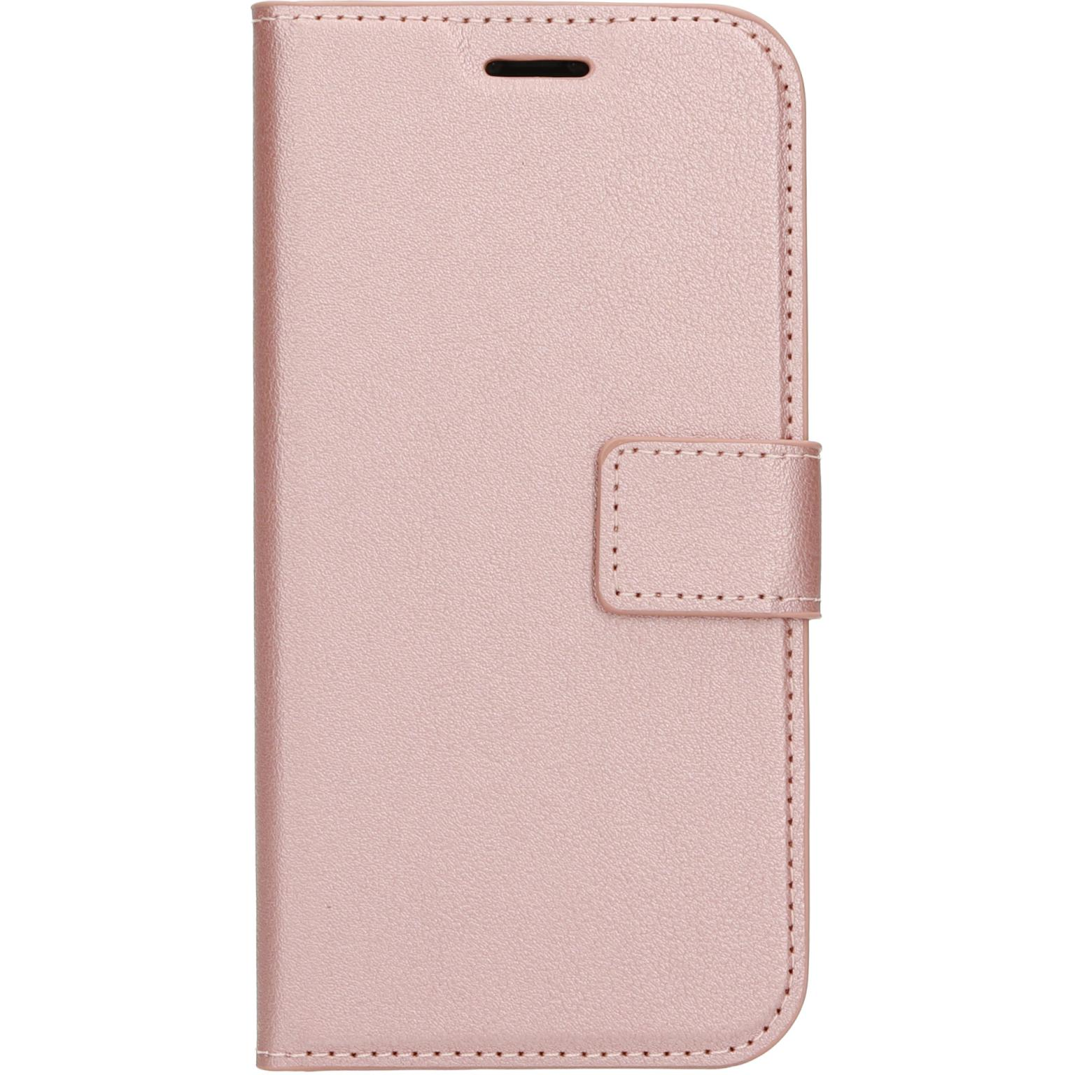 Pink phone wallet case, closed, with a clasp. White background.