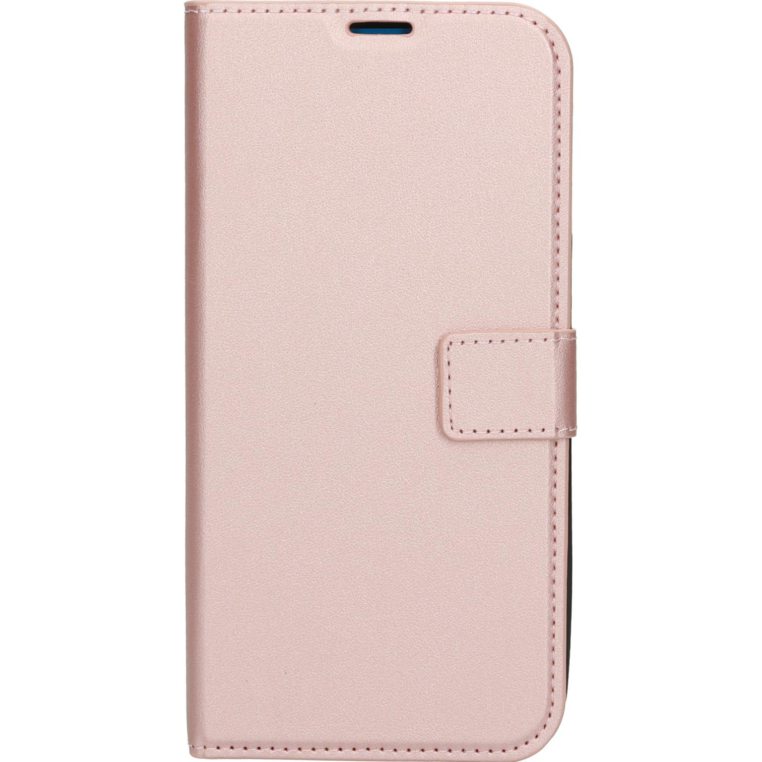 Roze telefoonhoes, gesloten. Rechthoekige vorm met een magnetische sluiting. Effen, glad oppervlak.