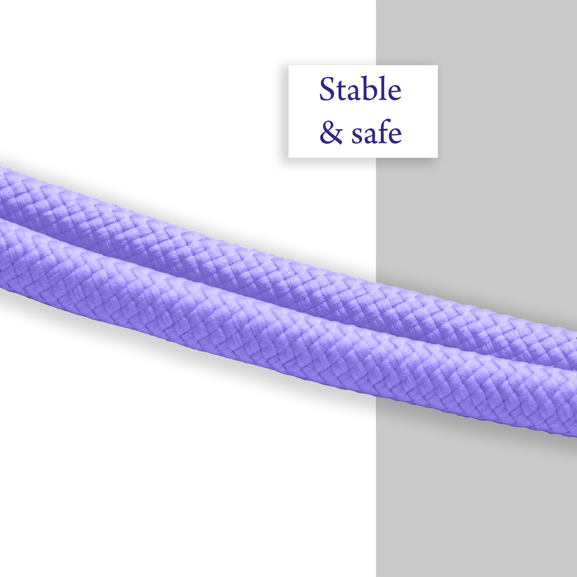 Nahaufnahme eines lila geflochtenen Lanyard-Seils. Weißer und grauer Hintergrund.