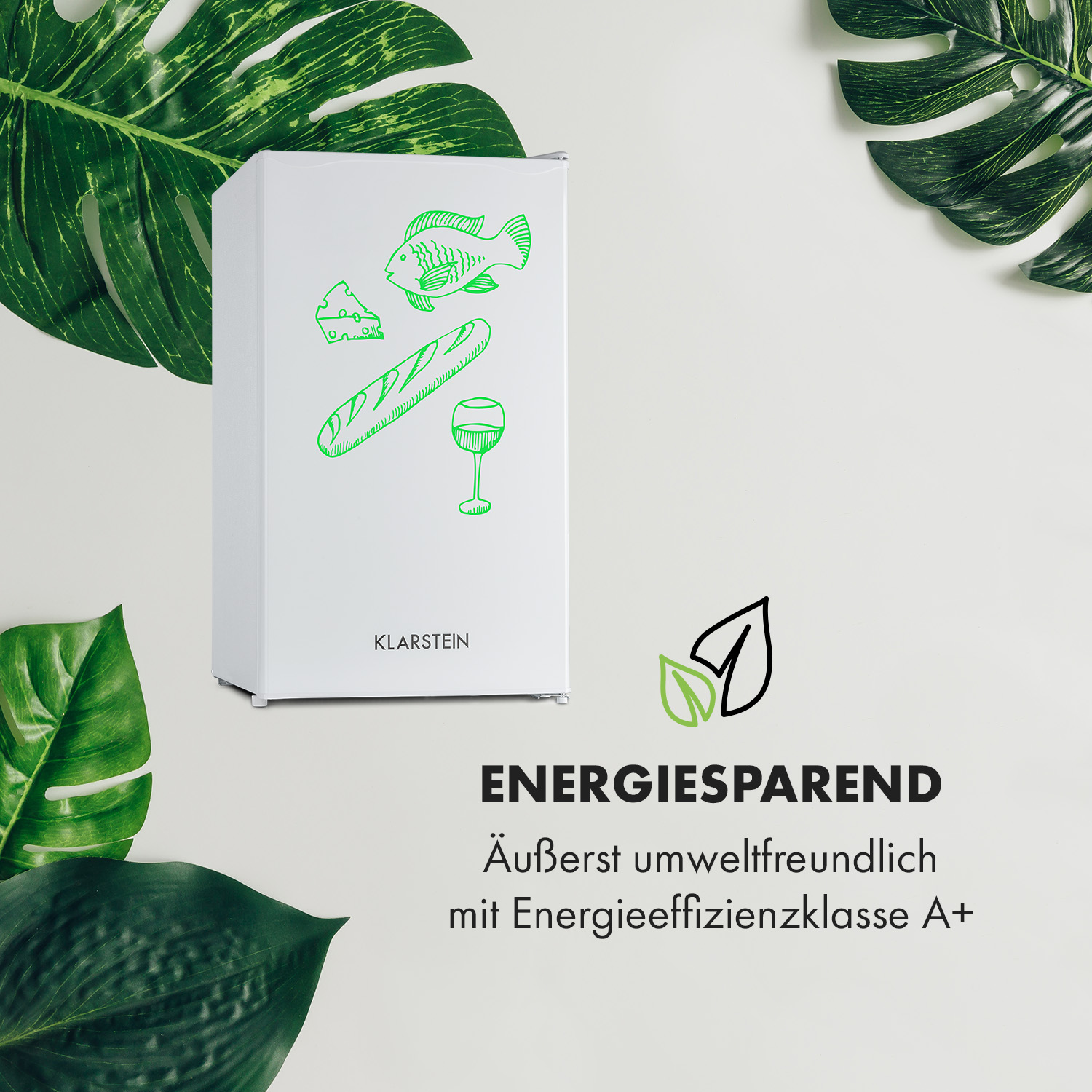 Una nevera blanca con ilustraciones de alimentos y hojas verdes.