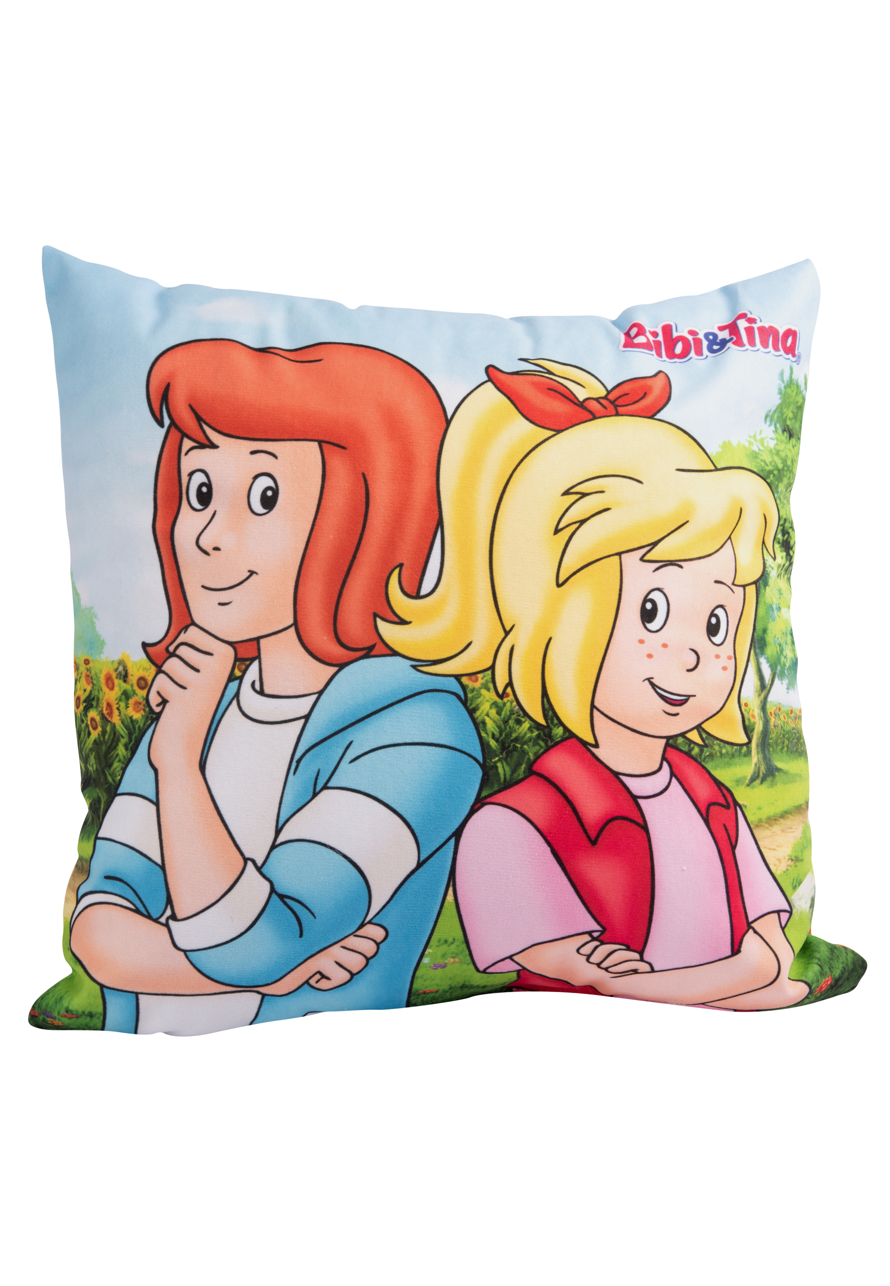 Kissen mit Cartoon-Mädchen. Eins rothaarig, gestreiftes Hemd. Das andere blond, rosa Oberteil, beide lächeln.