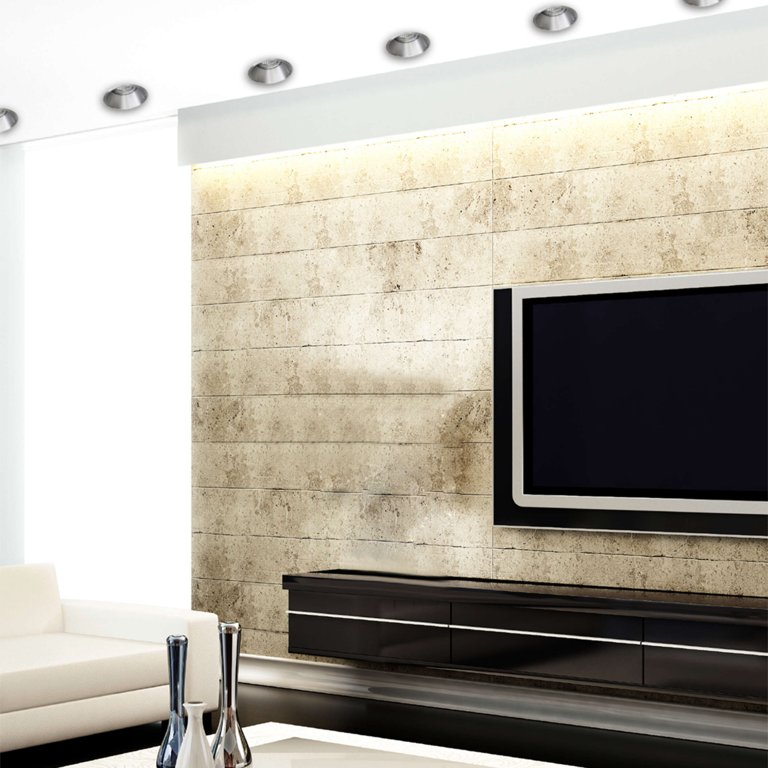 Modernes Wohnzimmer mit Einbaustrahlern, TV und weißem Sofa.