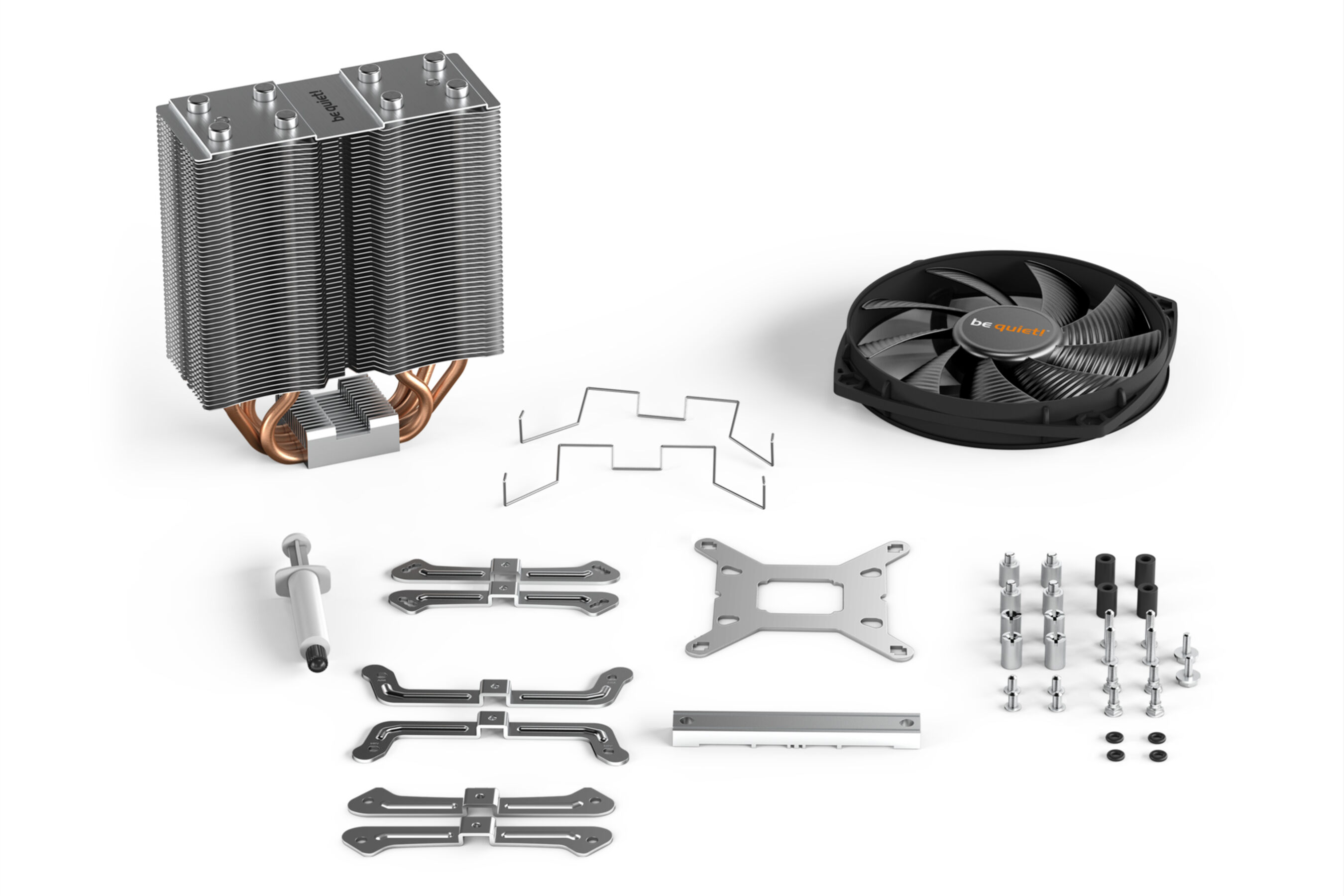 Chłodzenie procesora zdemontowane z komponentami i akcesoriami oraz wentylatorem, białe tło.