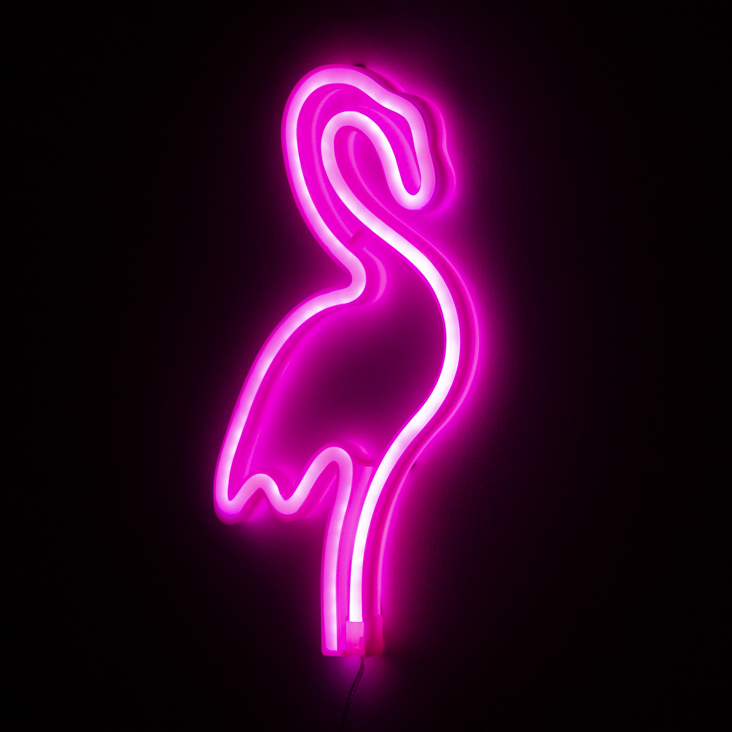 Flamenco neón rosa sobre fondo negro. Contorno brillante. Arte moderno.