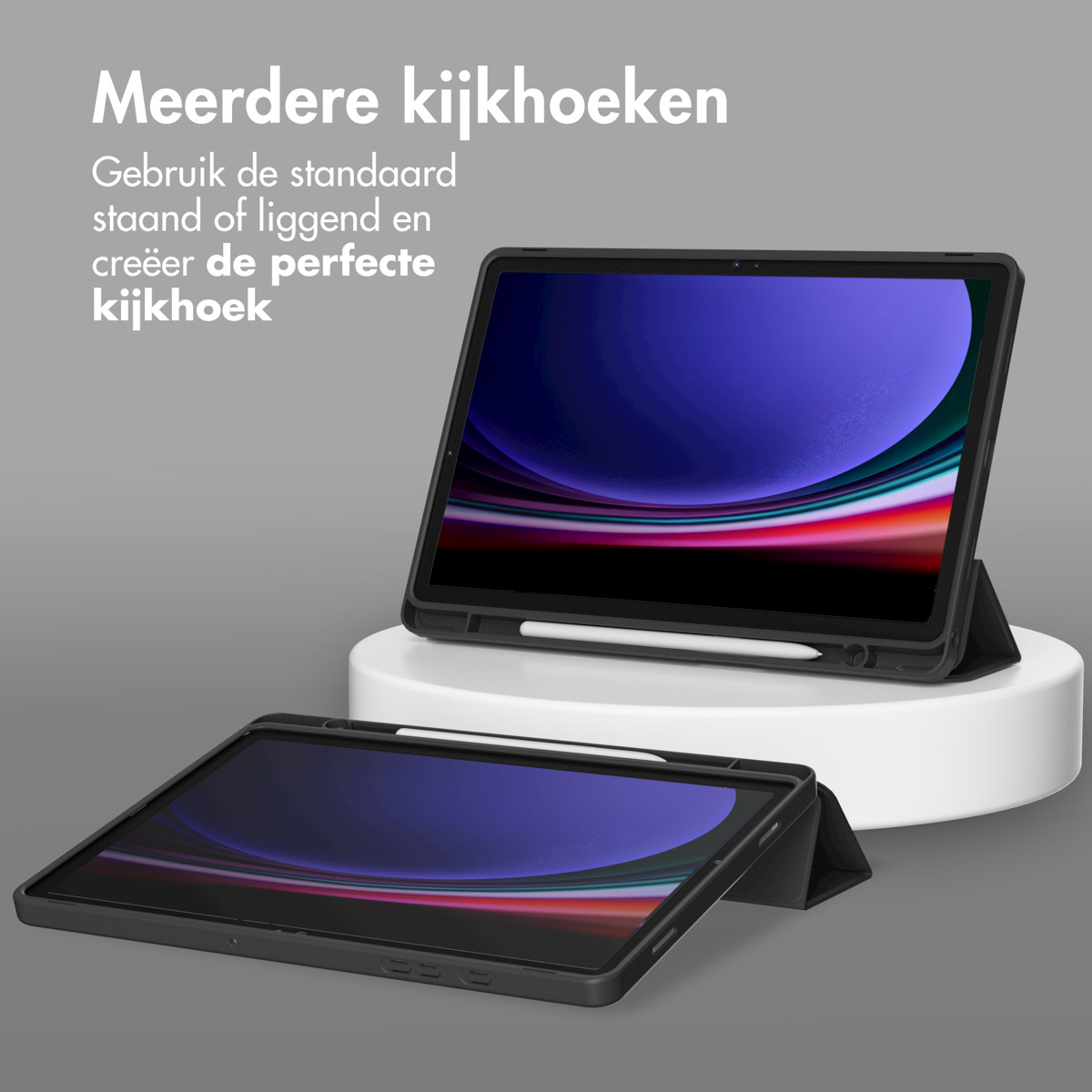 Tablets in a case, one in use, one in the background. The case is black.