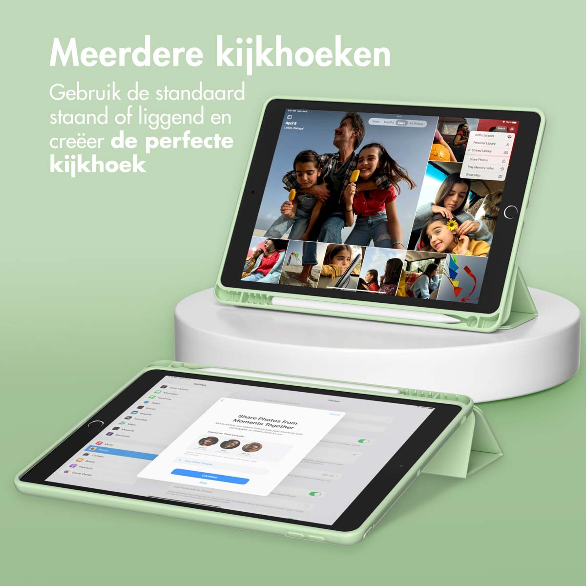 Green tablet case with tablets on a white stand. The tablets are open and showing a screen.