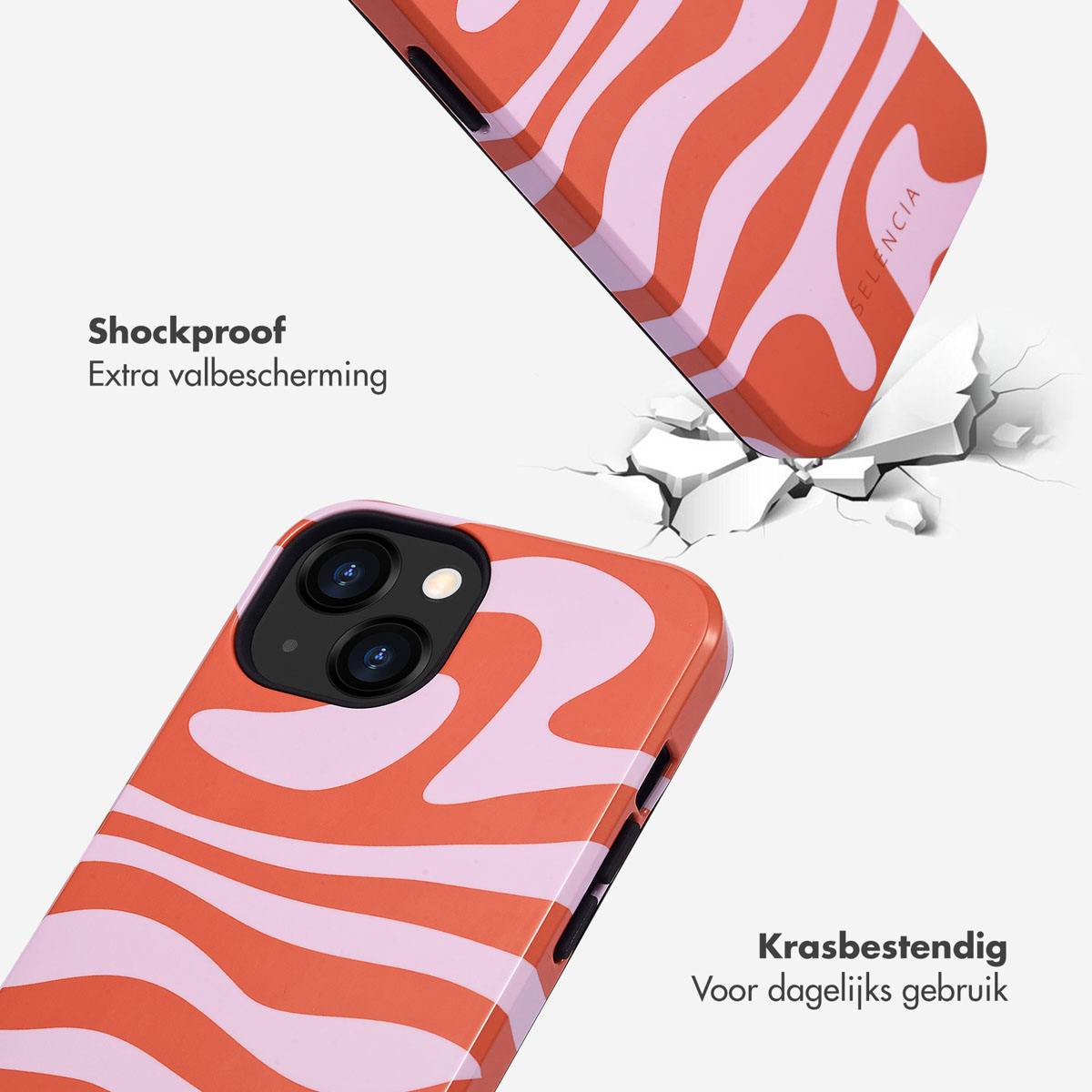 Coque de téléphone orange à motif ondulé rose tombant sur un sol craquelé.