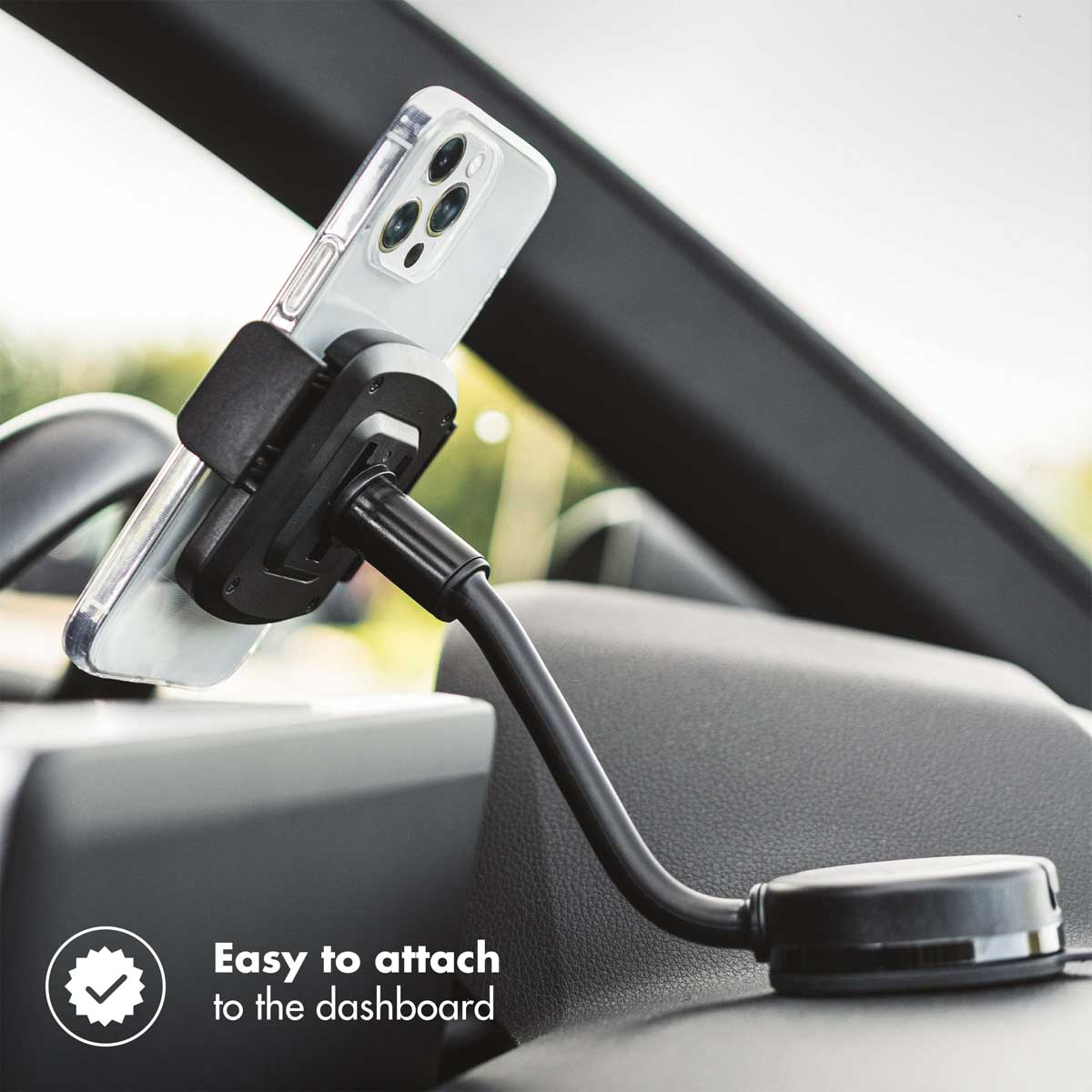 Phone in car mount, attached to dashboard. Black mount and phone case.