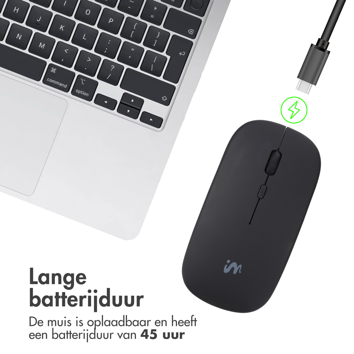 Black computer mouse with a charging cable connected to a laptop.