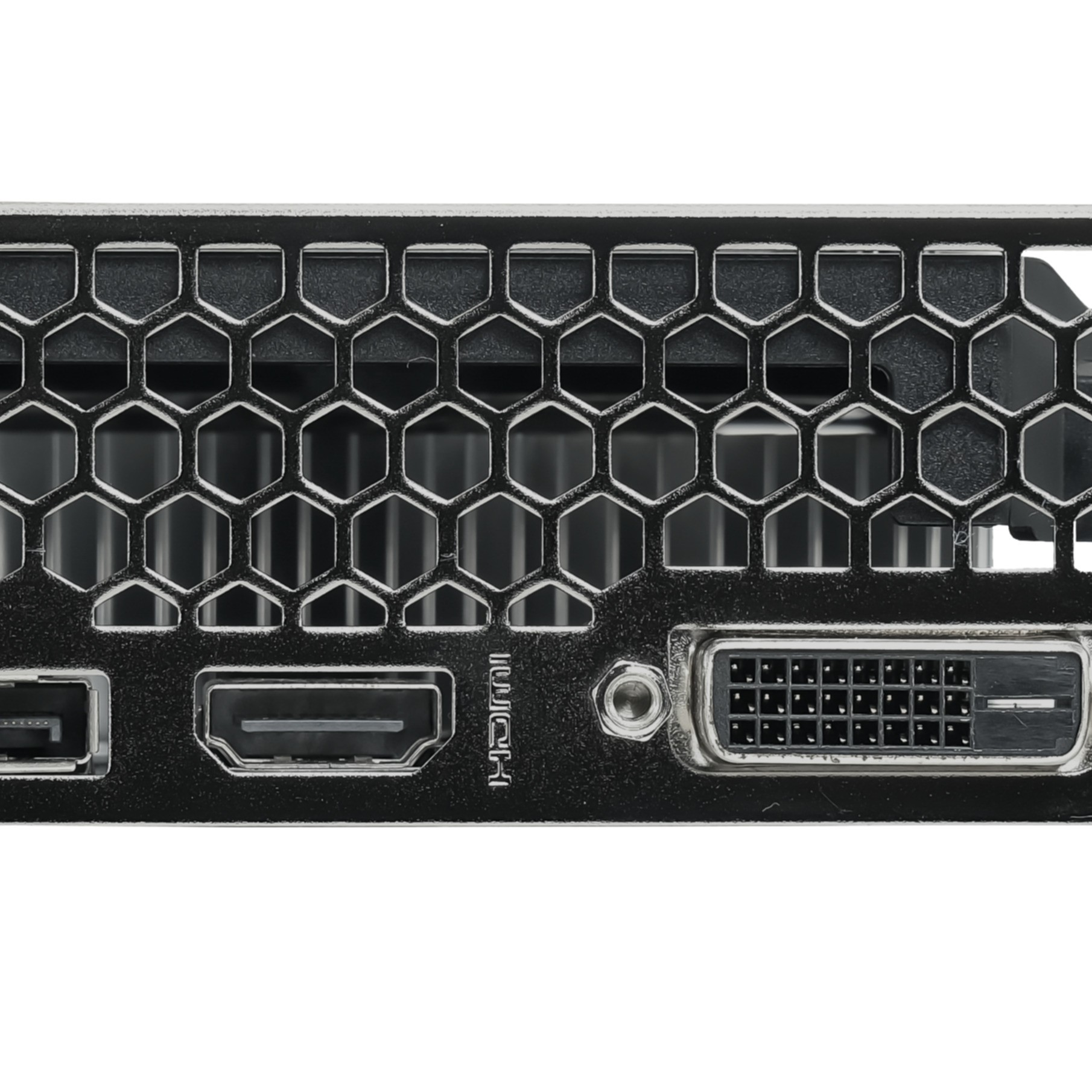 Primo piano del pannello posteriore di un computer, con porte HDMI e DVI e una griglia a nido d'ape.