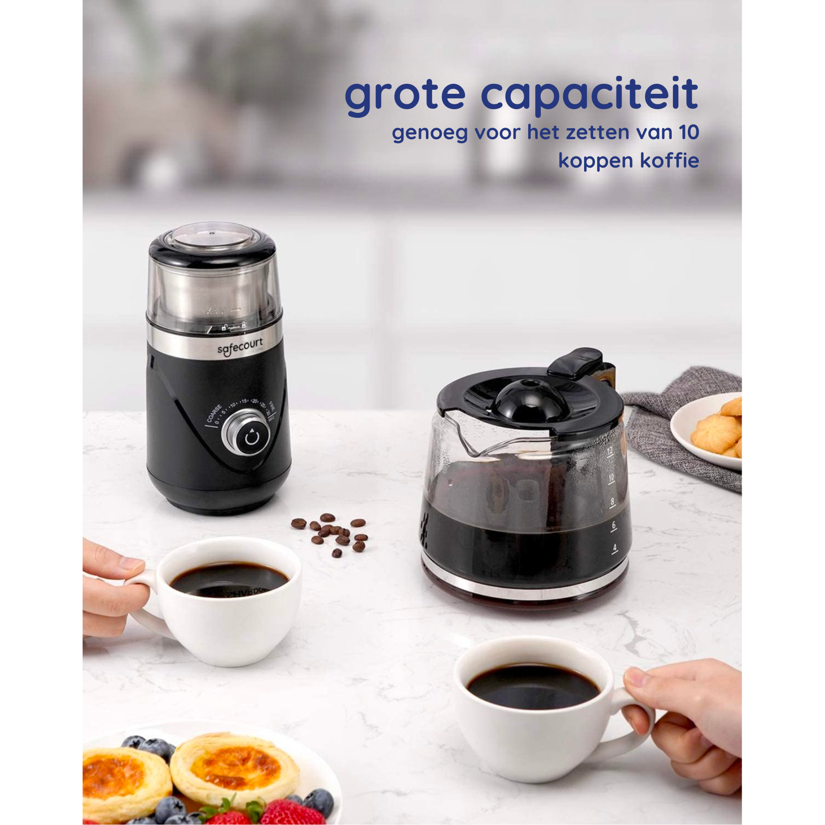Coffee grinder and coffee maker with two white cups of coffee on a table.