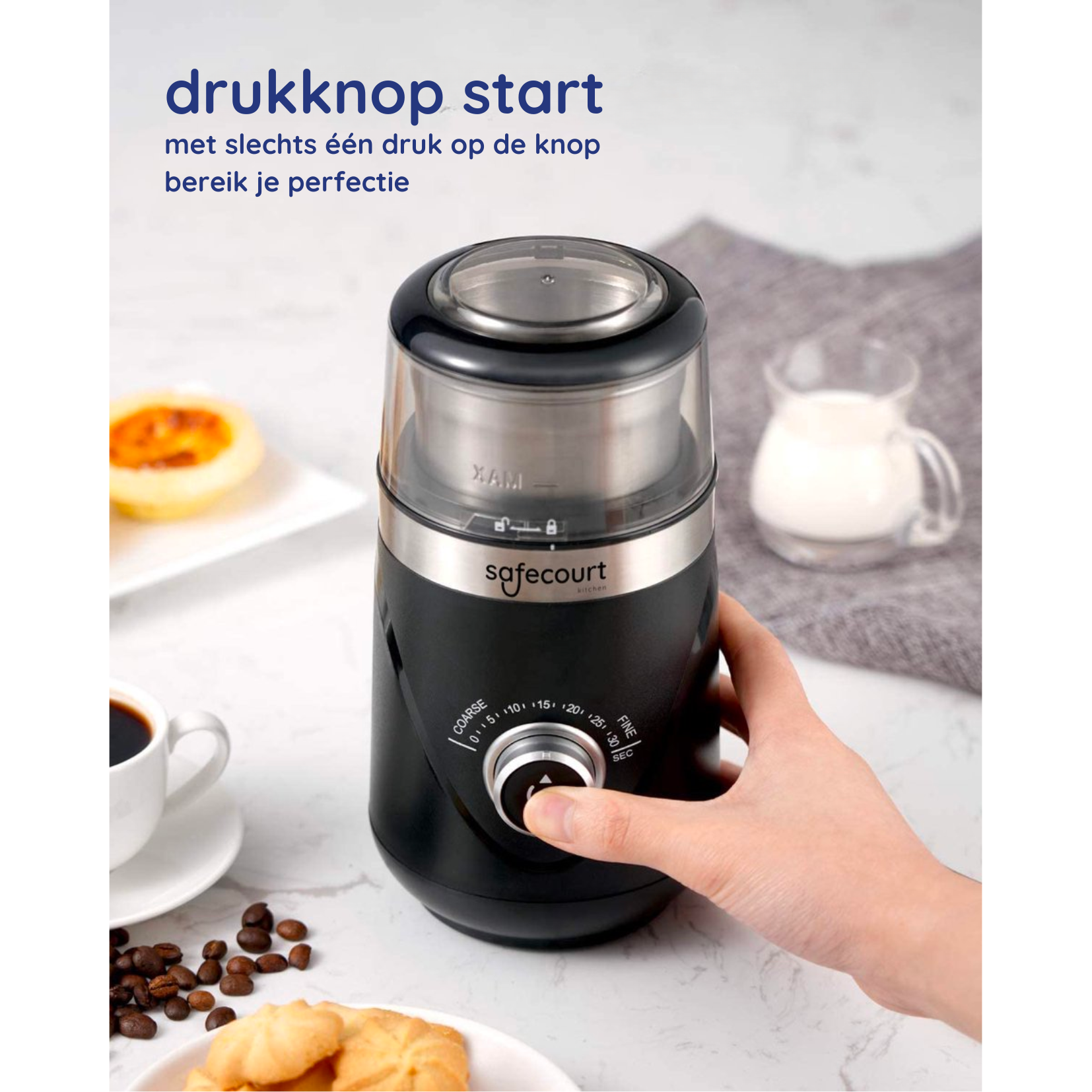 Black coffee grinder with a hand holding and cup of coffee.