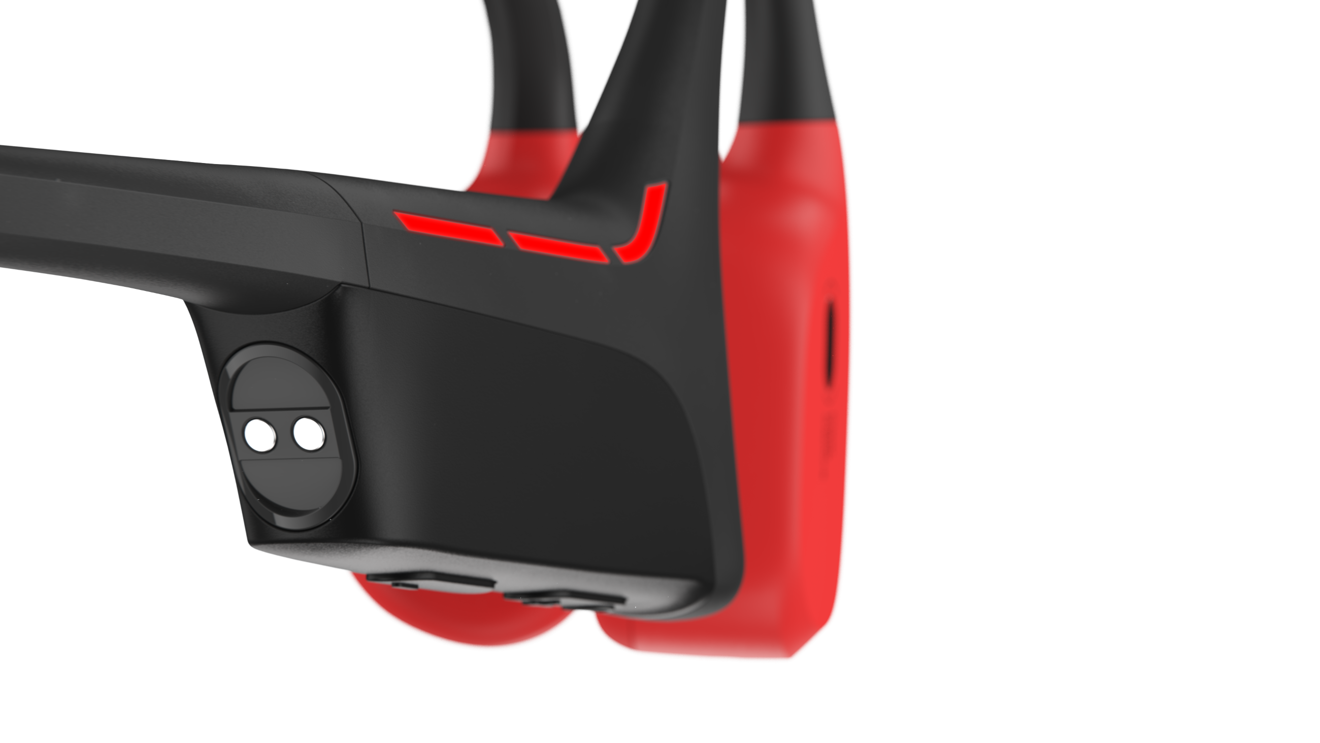 Zbliżenie słuchawek przewodnictwa kostnego w kolorze czarnym i czerwonym.