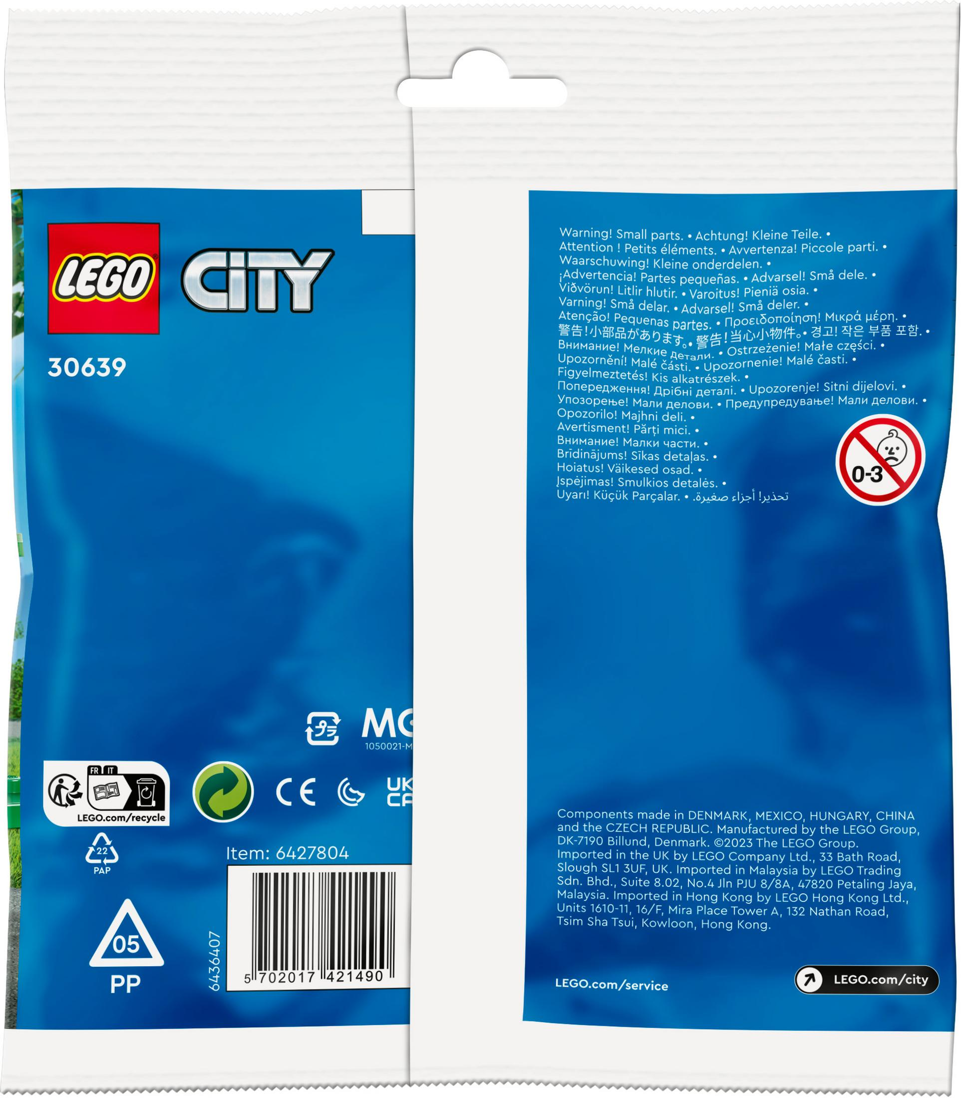 Uyarılar ve geri dönüşüm bilgileri içeren LEGO City oyuncak paketi.
