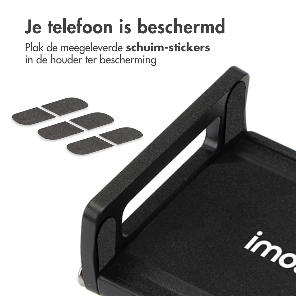 Black phone holder with stickers. Three foam stickers. Black background. Foam stickers close-up.