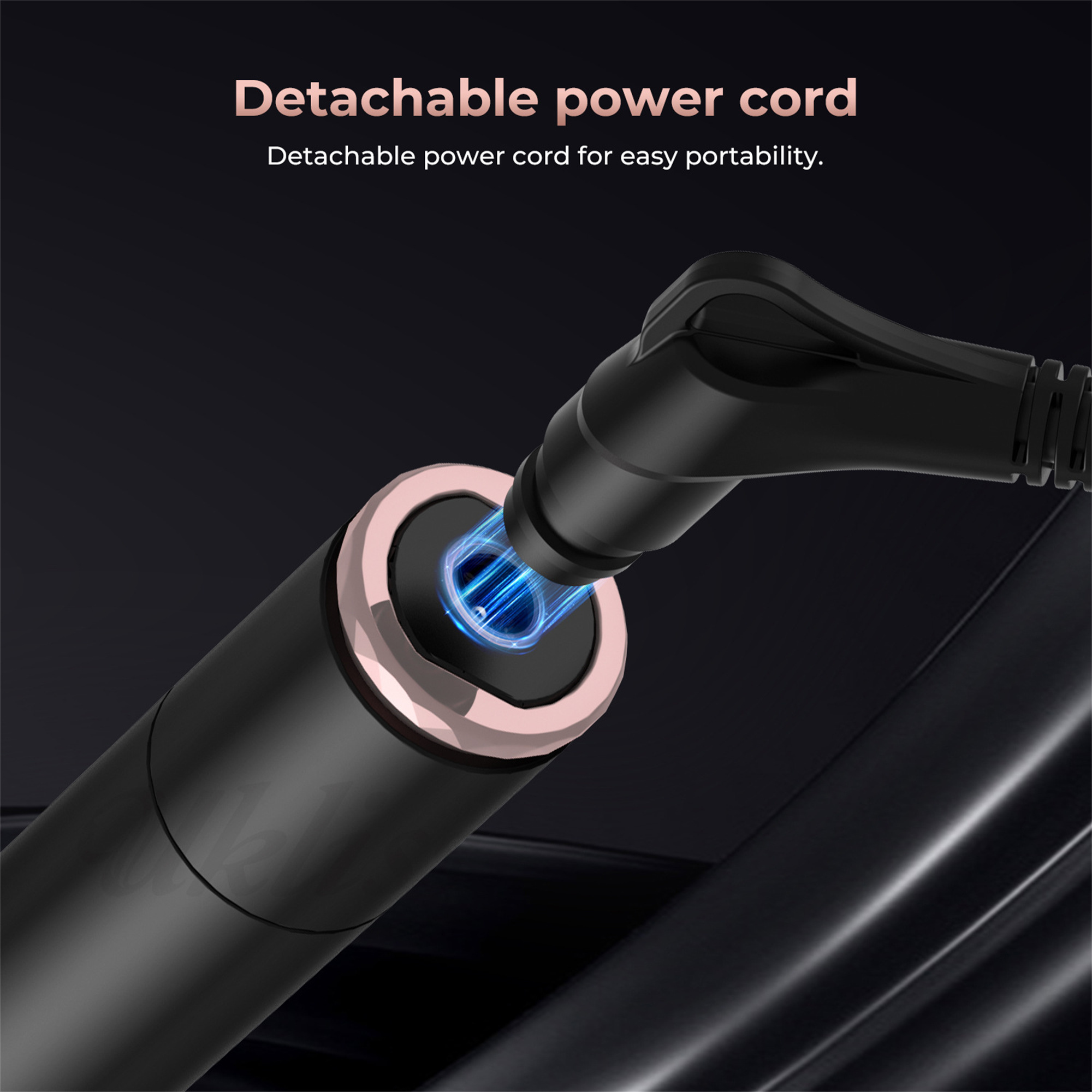 Ein schwarzes Netzkabel ist in ein schwarzes Gerät eingesteckt. Das Kabel ist mit einem roségoldenen Ring verbunden.