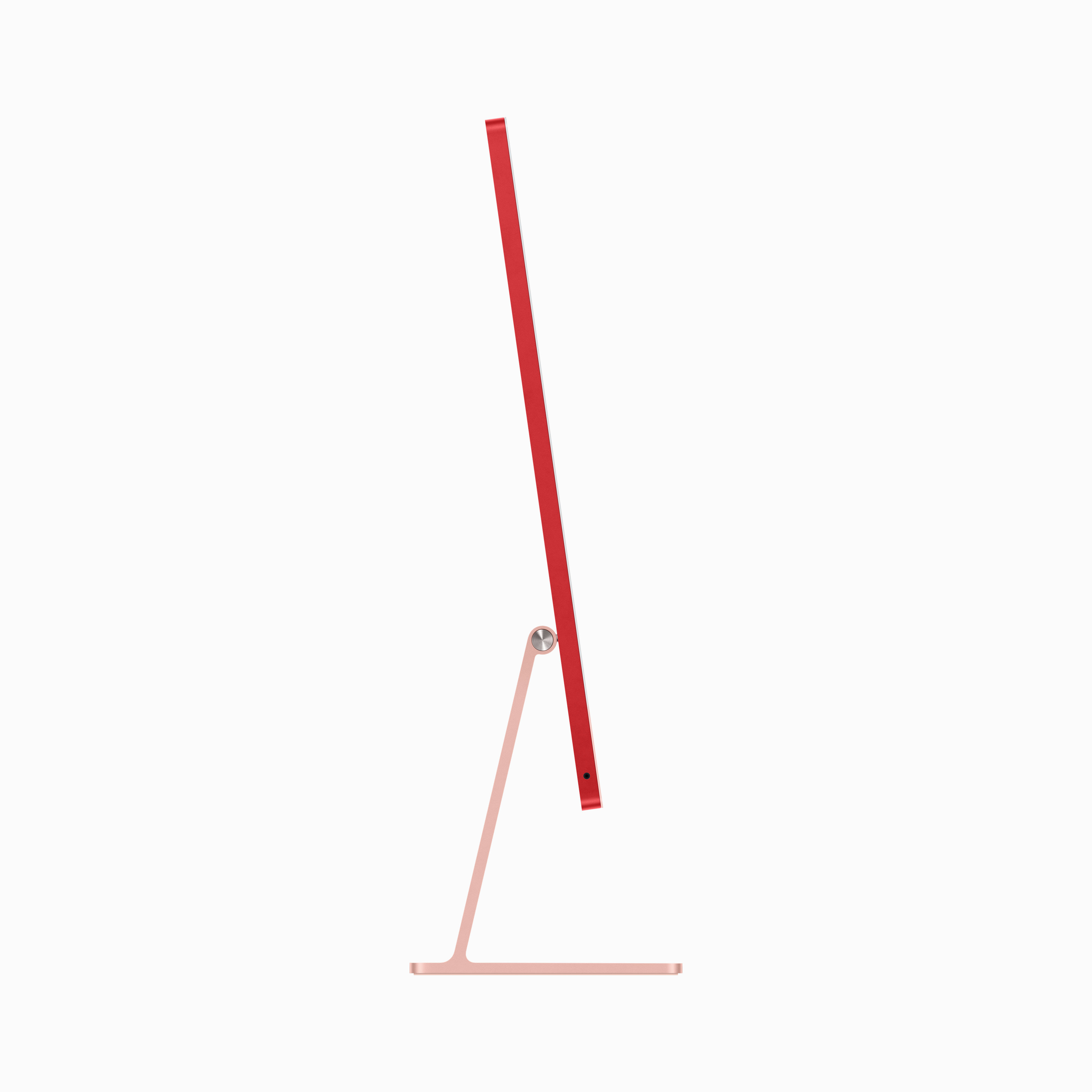 Czerwony komputer iMac z profilu, podstawa i stojak w kolorze różowego złota.