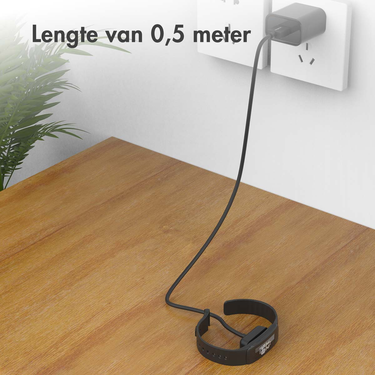 Câble de chargement noir branché sur une prise murale et connecté à une smartwatch noire sur bois.