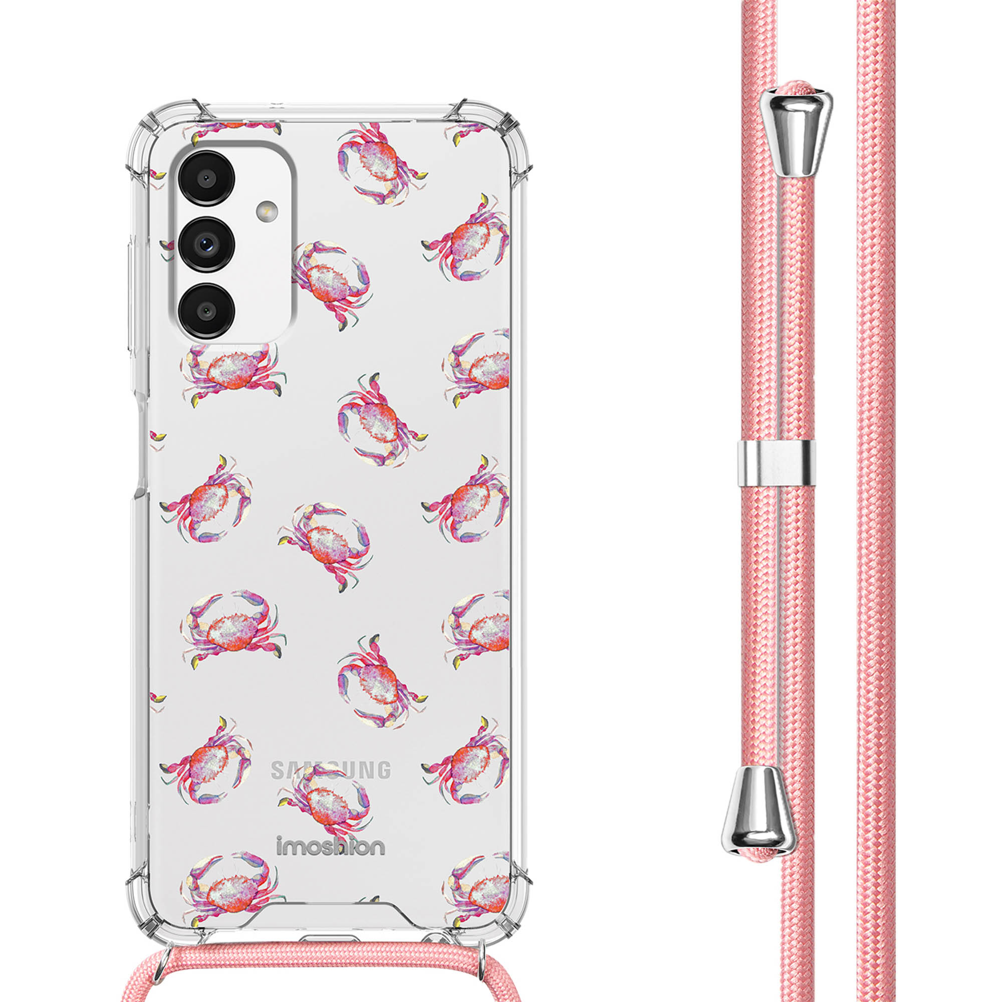 Un téléphone avec une coque à motifs de crabes et une lanière rose. La lanière est attachée.