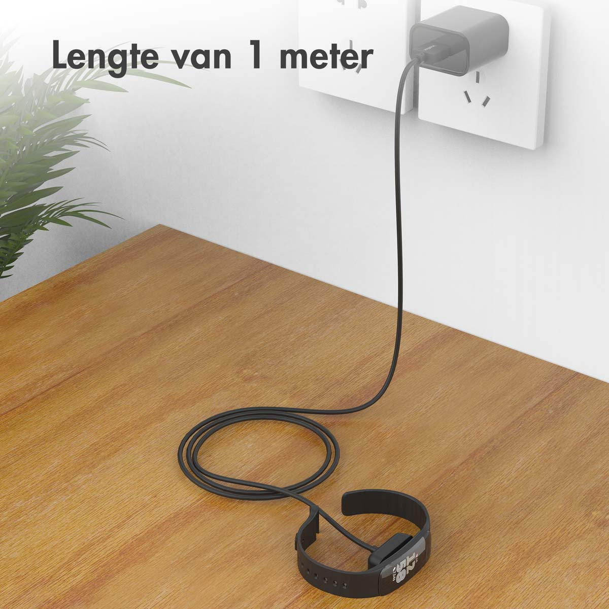 Une montre intelligente se chargeant sur une table en bois. Le câble est branché sur une prise.
