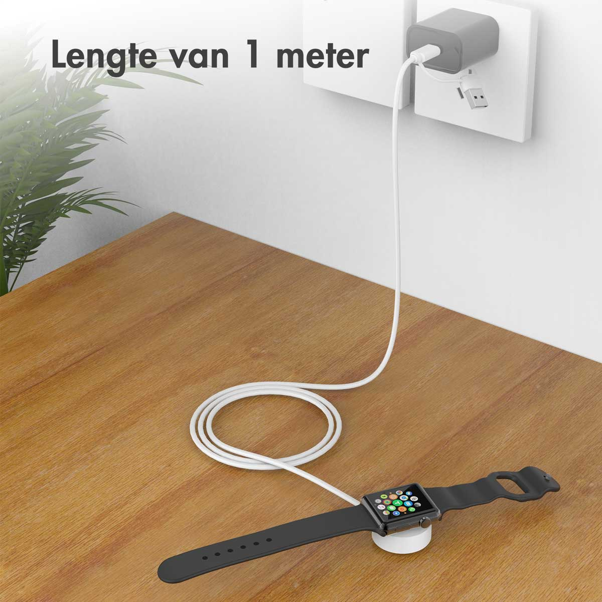 Smartwatch noir connecté à un chargeur, en charge sur une table en bois.