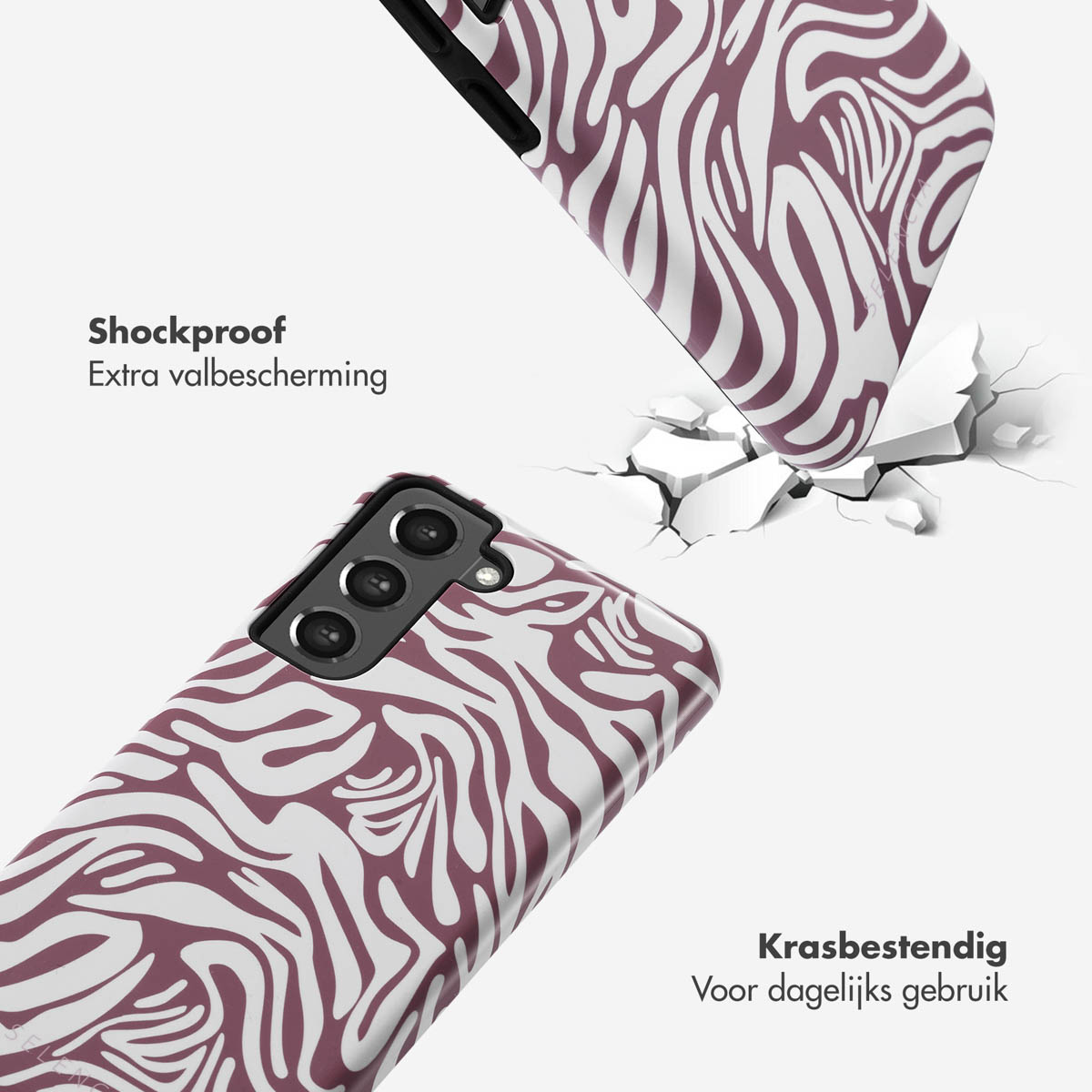 Due custodie per telefono che cadono e rompono una superficie. Design a fantasia zebrata. Testo dice 'Antiurto'.