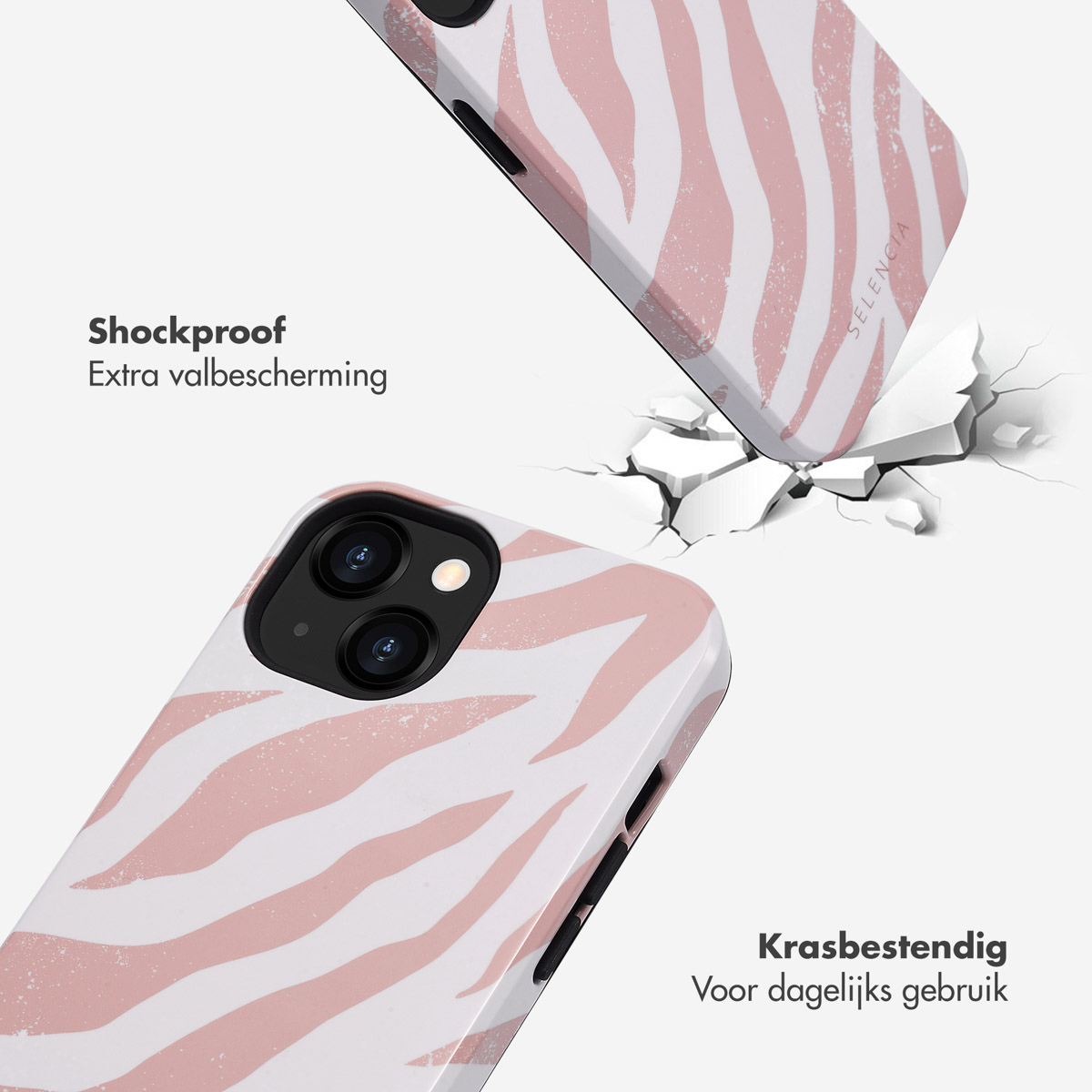 Deux téléphones avec des coques à imprimé zébré rose et blanc. Un téléphone brise la surface.