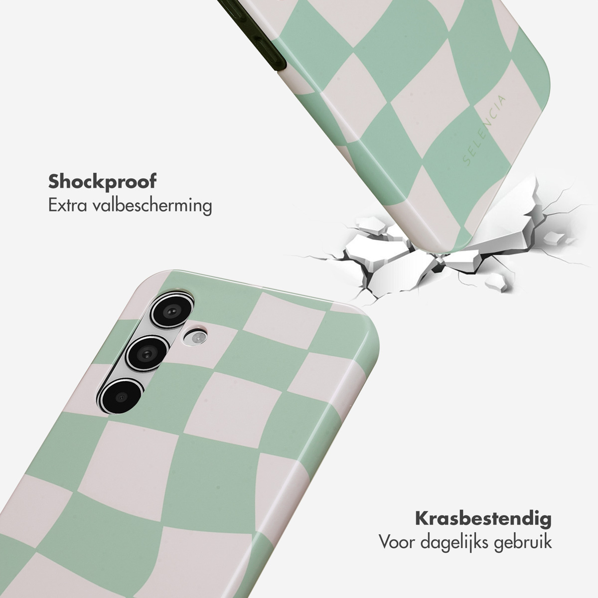 Twee telefoonhoesjes: een valt, een ligt. Beide zijn groen-wit geruit. De grond is gebarsten.