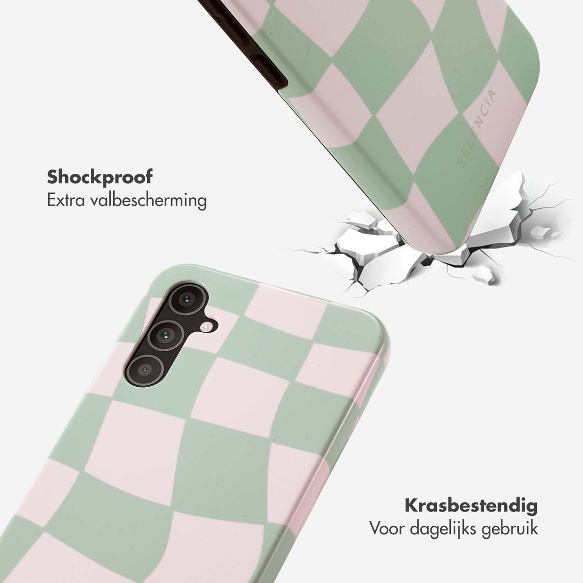 Telefoonhoesje in groen en roze ruitpatroon. Hoesje is schokbestendig. Telefoon ernaast is gebarsten.