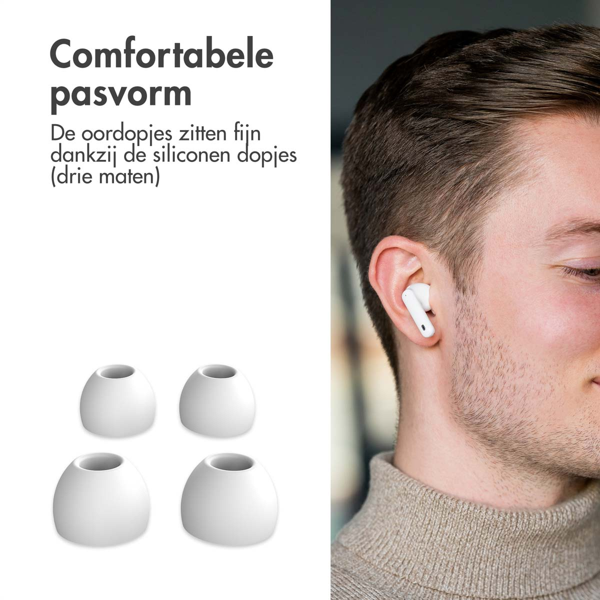 A man's face with earbuds in his ear. Four additional earbuds are in front.