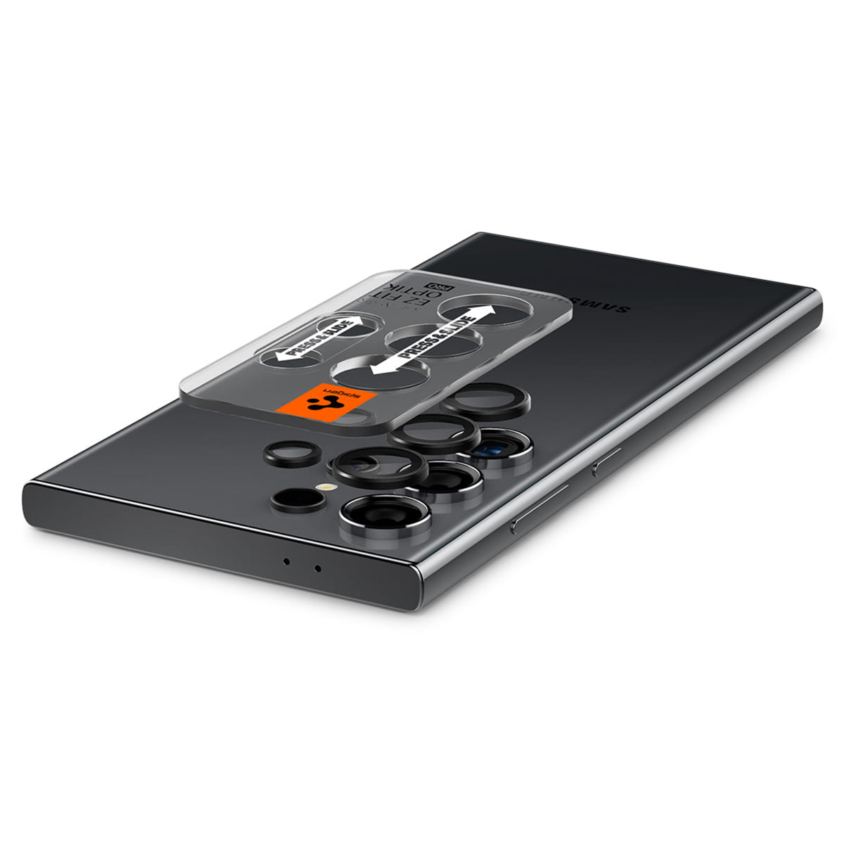 Telefon z narzędziem do nakładania osłony. Narzędzie jest przezroczyste, a telefon srebrny i czarny.