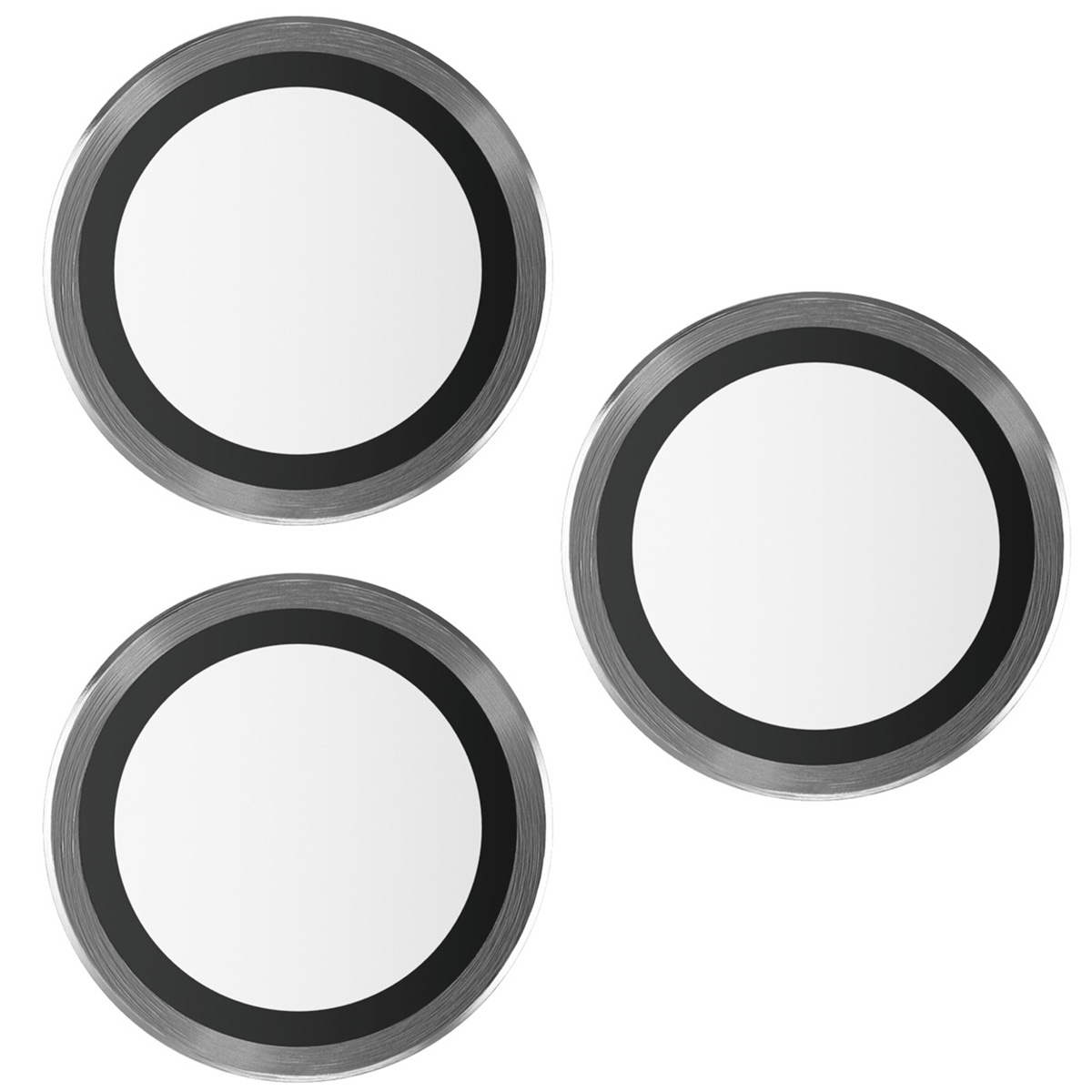 Trois protecteurs d'objectif de caméra métalliques avec des cercles noirs à l'intérieur.