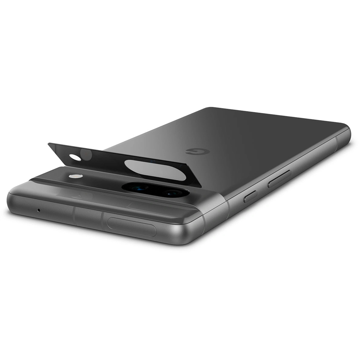 Un téléphone gris foncé avec le cache de l'objectif de l'appareil photo ouvert. Il est posé sur une surface.