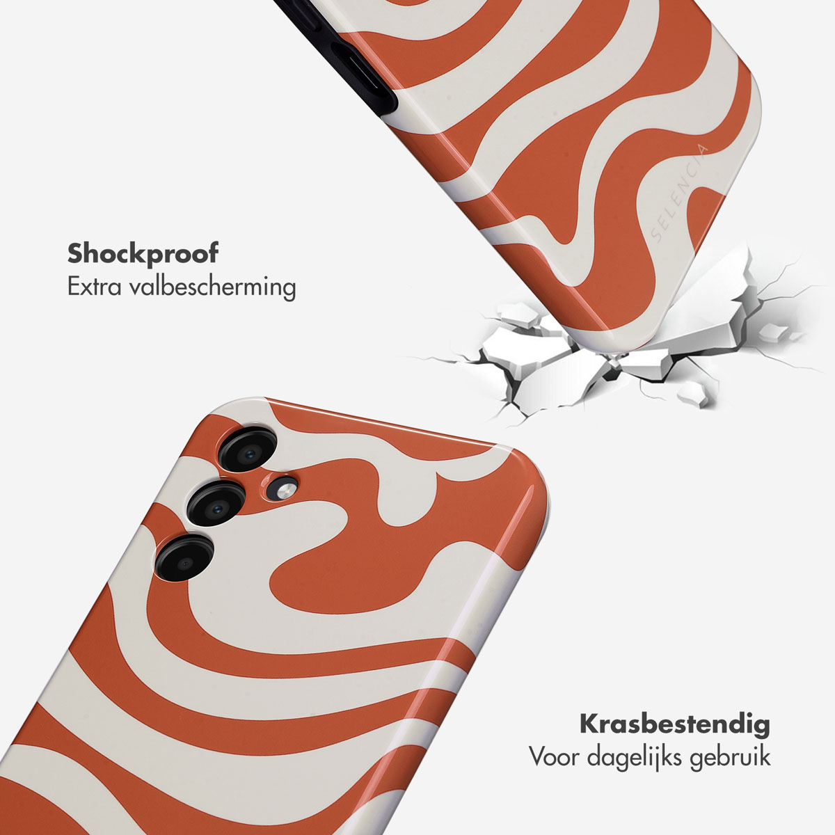 Twee telefoons, één met een hoesje met oranje en witte golvende lijnen, de andere is kapot.