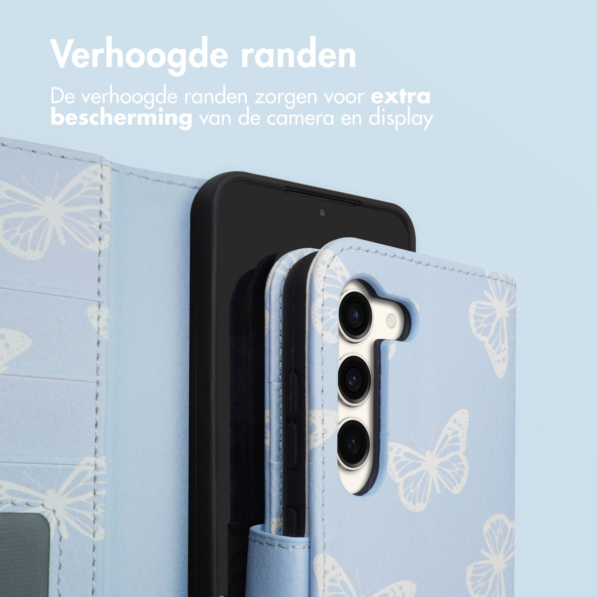 Phone in a case with a blue butterfly pattern. Case has raised edges. Shows camera protection.